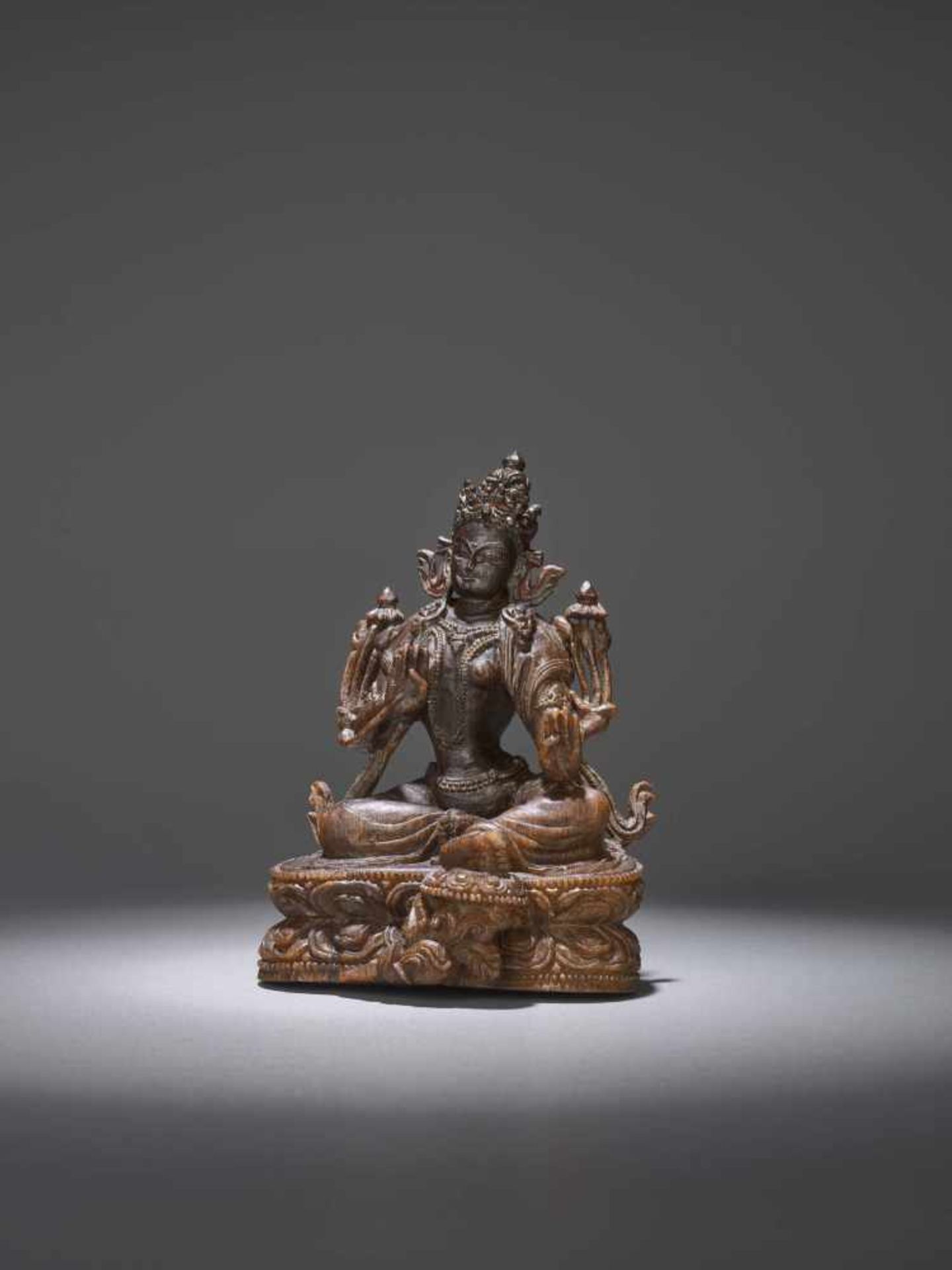 AN EXTREMELY RARE 17th CENTURY RHINOCEROS HORN CARVING OF A GREEN TARA This lot is published and - Image 3 of 8