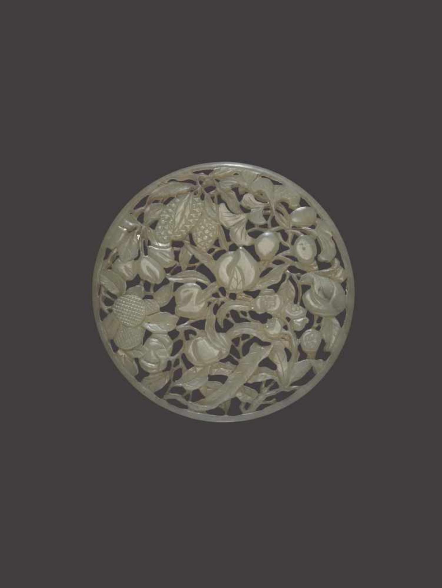 A RETICULATED CELADON JADE PLAQUE, QING DYNASTY Celadon jade of even color with sparse dark grey