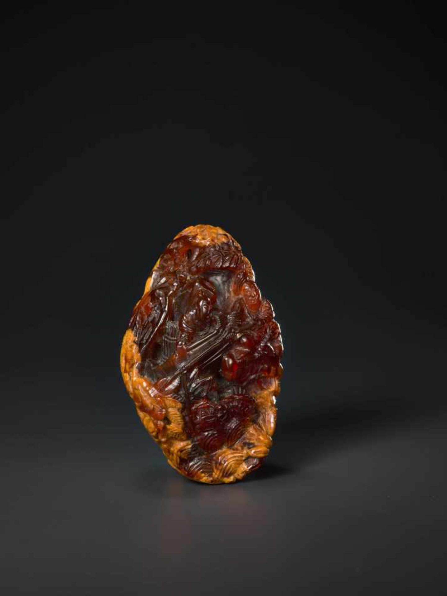 AN 18th CENTURY AMBER PEBBLE CARVING ‘VILLAGE LIFE’ Amber of deep red and caramel color, opaque - Image 2 of 8