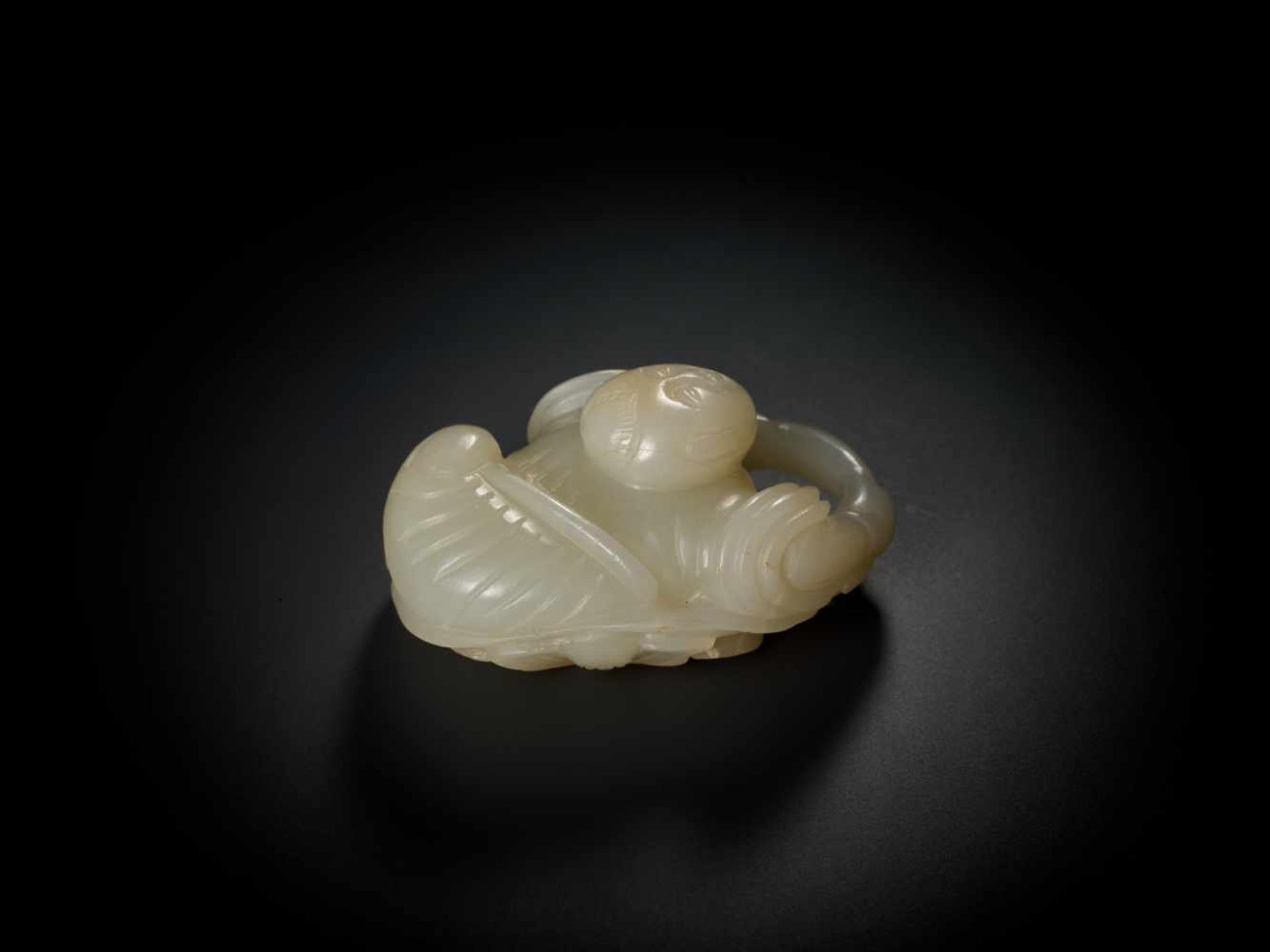 AN 18TH CENTURY JADE ‘BOY AND LOTUS’ CARVING Pale celadon jade of even color and translucent - Image 2 of 7