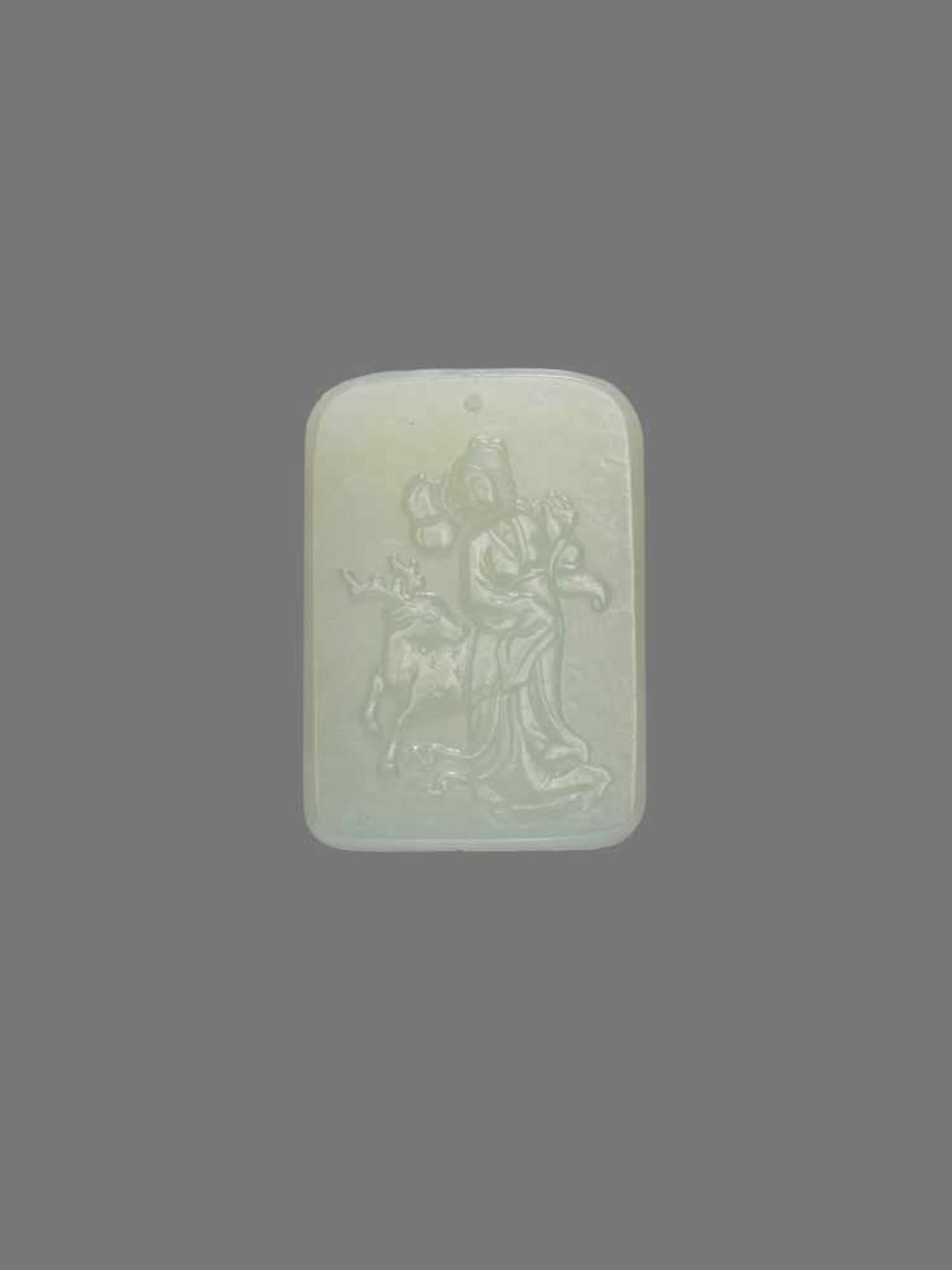 A SIGNED WHITE JADE PLAQUE PENDANT WITH MAGU White jade, smooth surface polish. The backside bearing