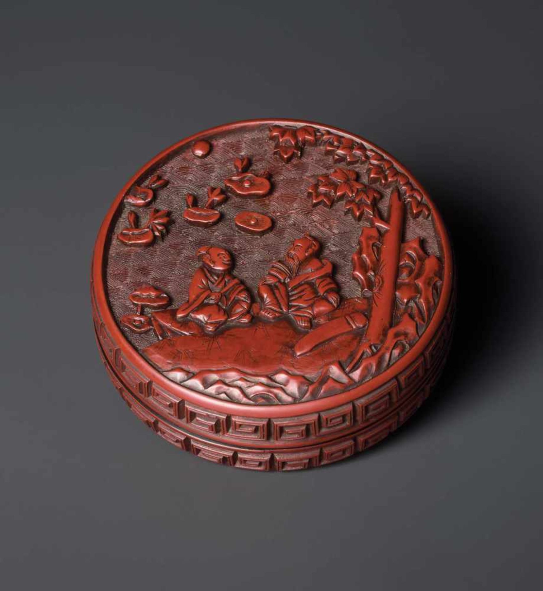 A CINNABAR LACQUER ‘MUSICIANS’ BOX AND COVER, MING DYNASTY, 16TH CENTURY Carved cinnabar lacquer