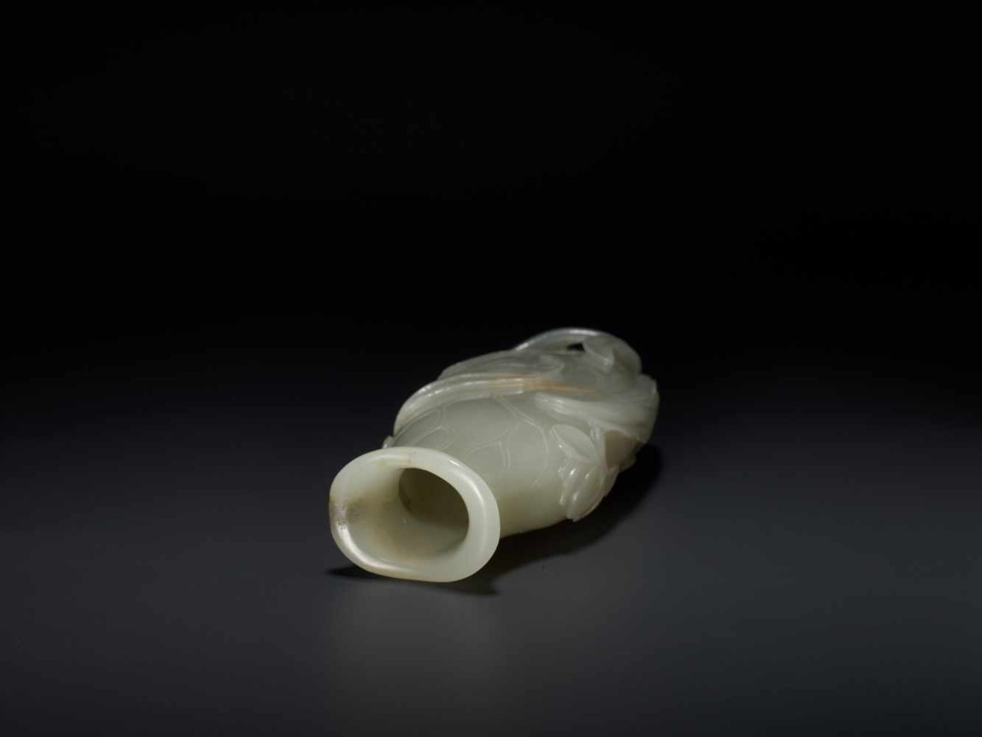 AN 18TH CENTURY CELADON AND RUSSET JADE LOTUS VASE Pale celadon with sparse russet inclusions, - Image 6 of 8