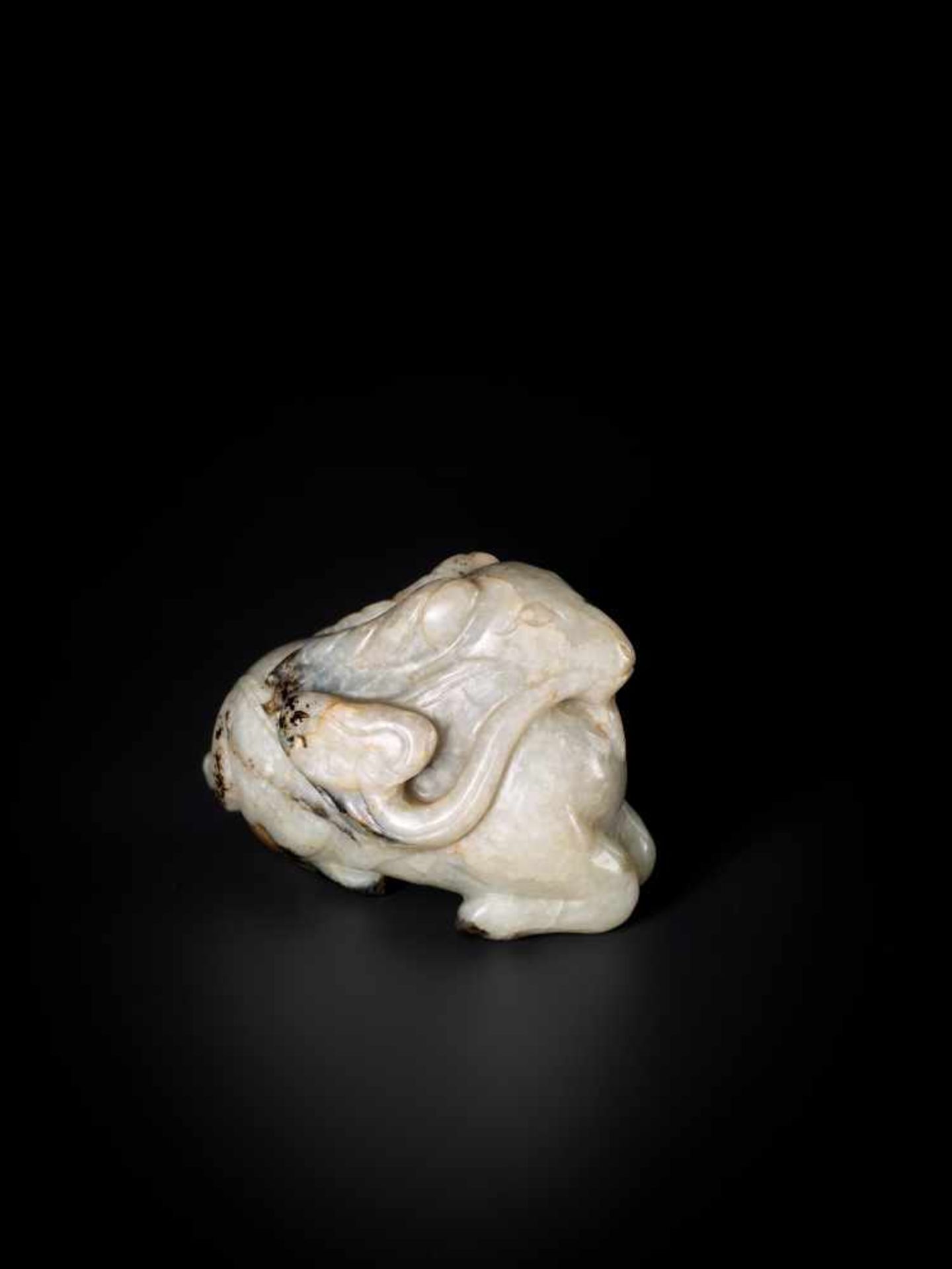 A MING DYNASTY MOTTLED JADE CARVING OF A RAM WITH LINGZHI Celadon, brown and black mottled jade, - Image 3 of 6