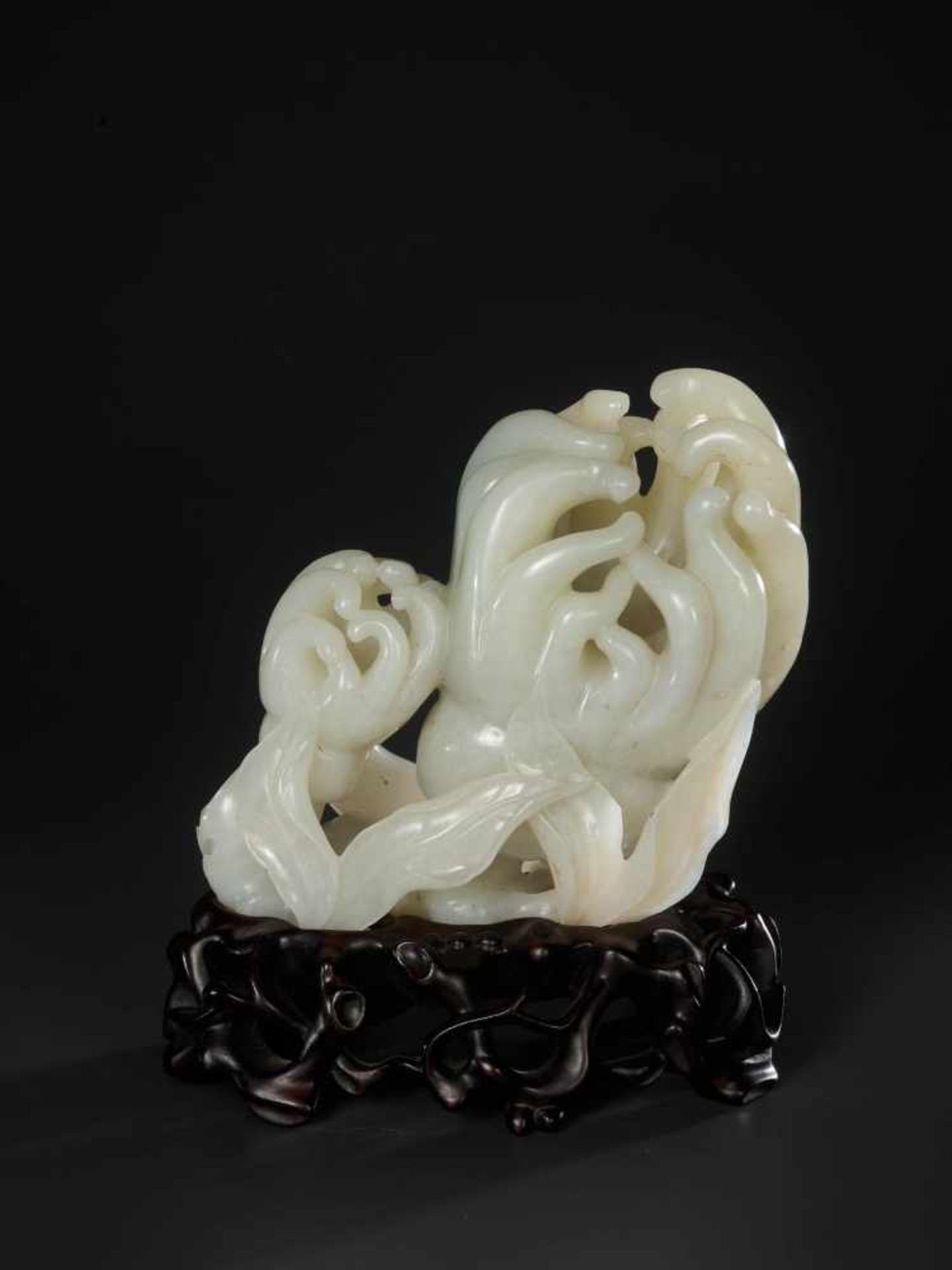 A SUPERBLY CARVED WHITE JADE GROUP OF FINGER CITRONS, QING DYNASTY, 18TH CENTURY White jade of