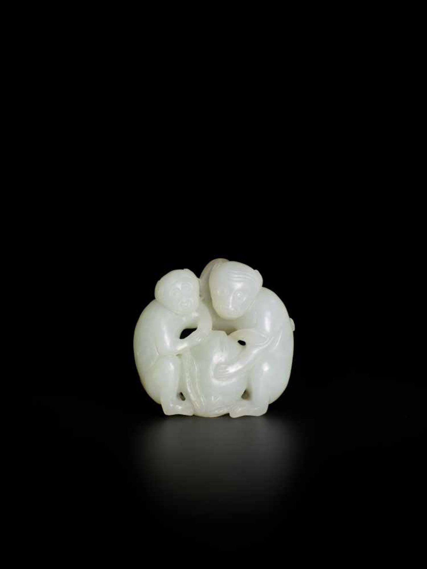 A QING DYNASTY WHITE JADE PENDANT OF TWO MONKEYS WITH PEACH White jade of translucent quality,