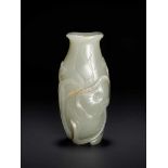 AN 18TH CENTURY CELADON AND RUSSET JADE LOTUS VASE Pale celadon with sparse russet inclusions,