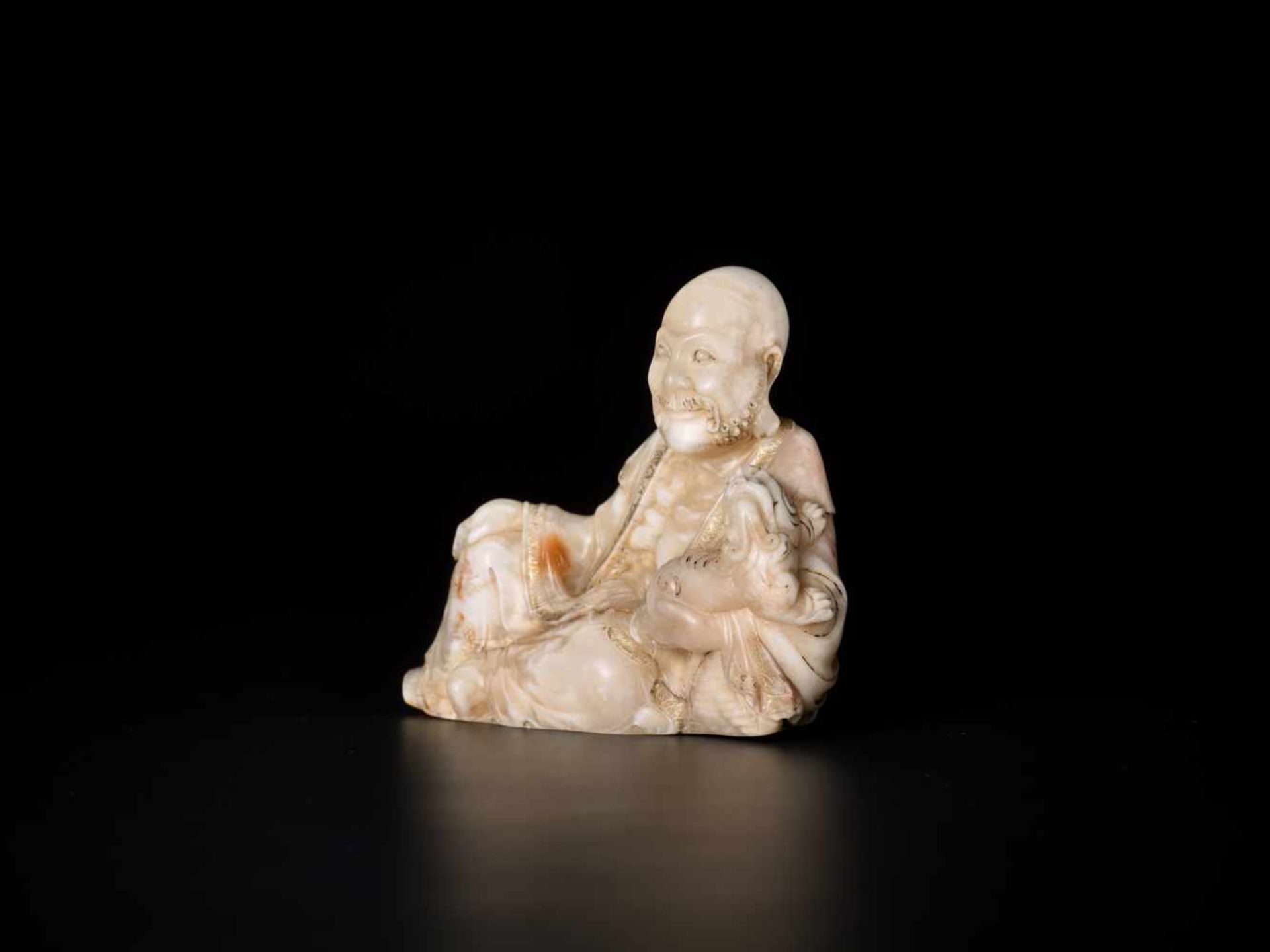 A MASTERLY CARVED 18th CENTURY SOAPSTONE FIGURE OF A LUOHAN WITH QILIN Soapstone of an opaque - Image 4 of 7