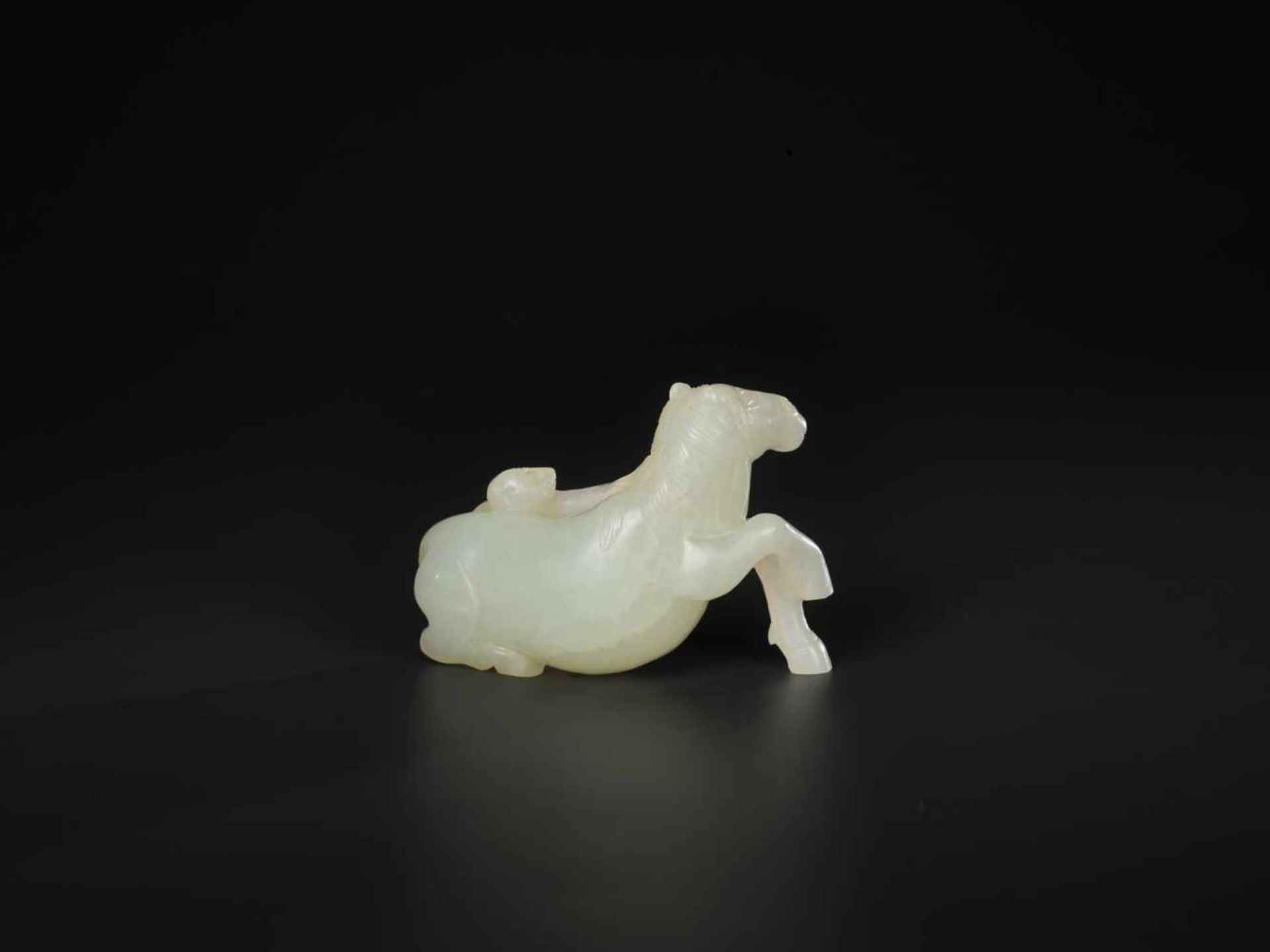 A PALE CELADON 'HORSE AND MONKEY' JADE CARVING, QING DYNASTY, 18TH / 19TH CENTURY The stone of even, - Image 2 of 7