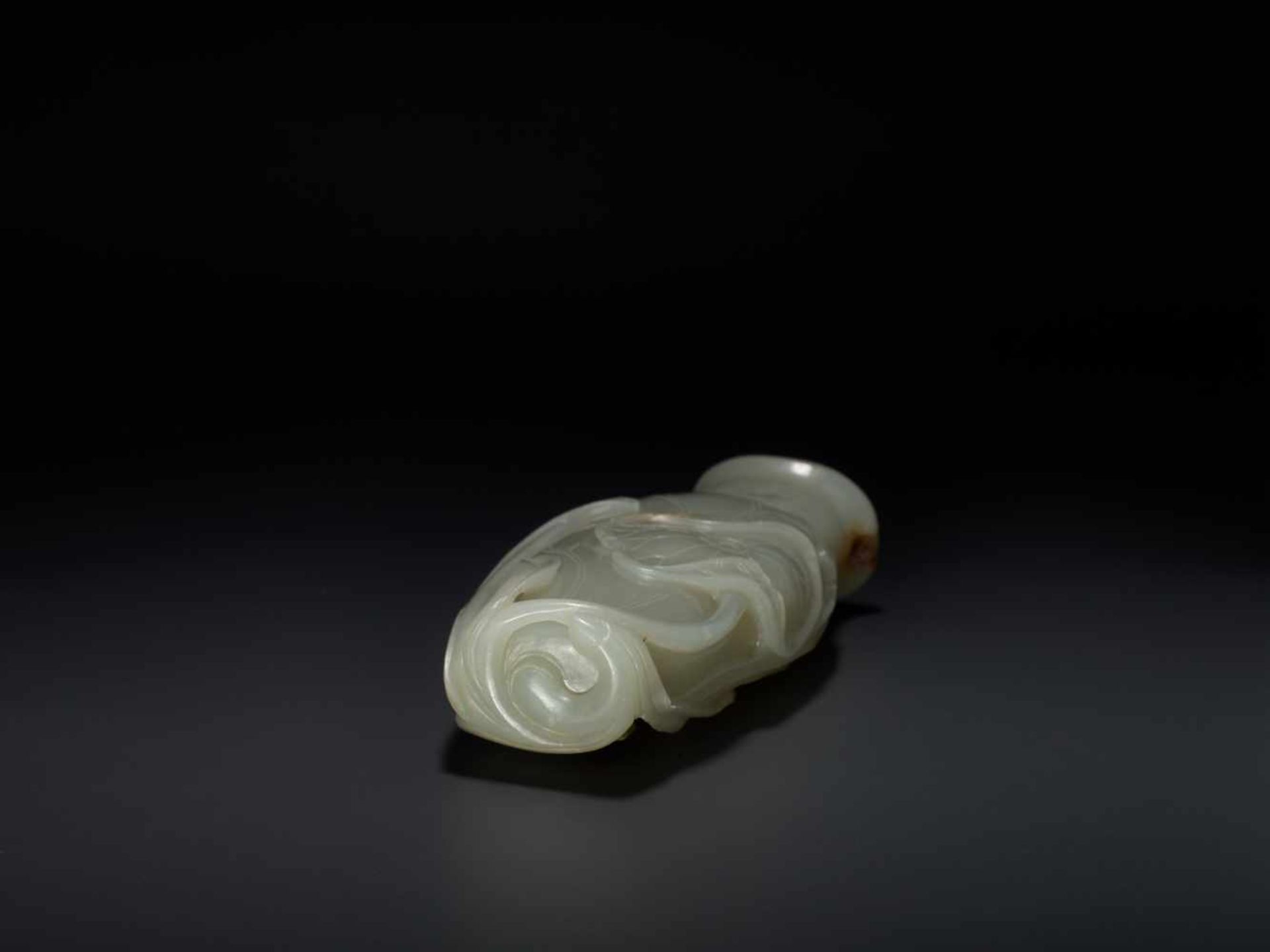 AN 18TH CENTURY CELADON AND RUSSET JADE LOTUS VASE Pale celadon with sparse russet inclusions, - Image 7 of 8