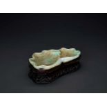 A GREEN AND RUSSET LOTUS-FORM JADEITE BRUSH WASHER WITH THREE-LEGGED TOAD, 1900s Jadeite in