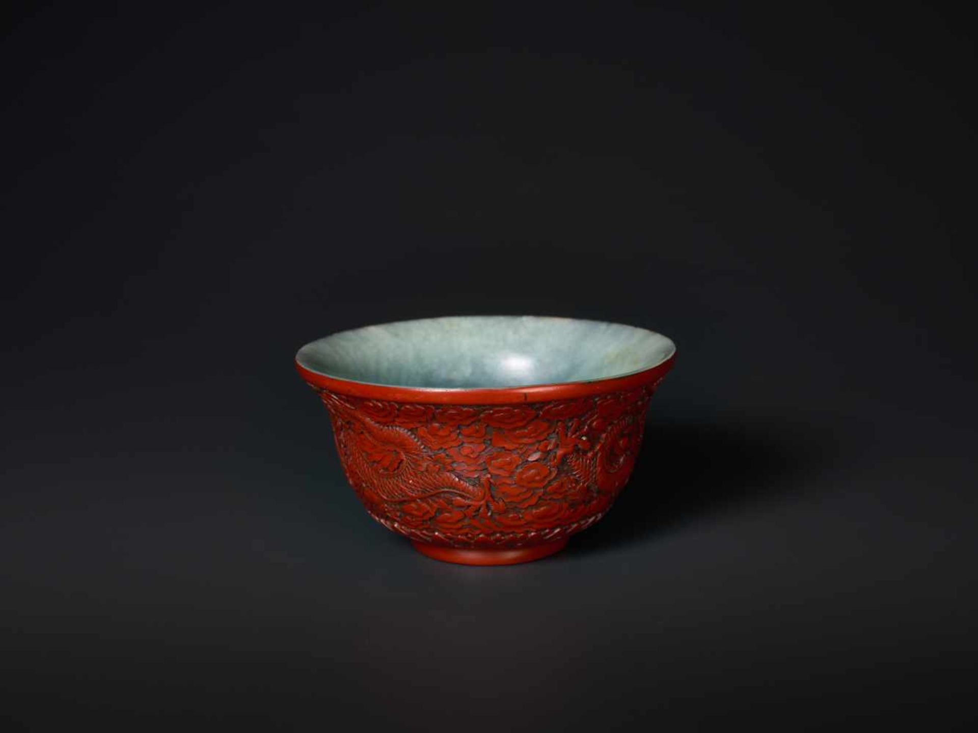 AN EXTREMELY RARE QIANLONG PERIOD CINNABAR LACQUER EMBELLISHED JADE BOWL Celadon and grey streaked - Image 5 of 7