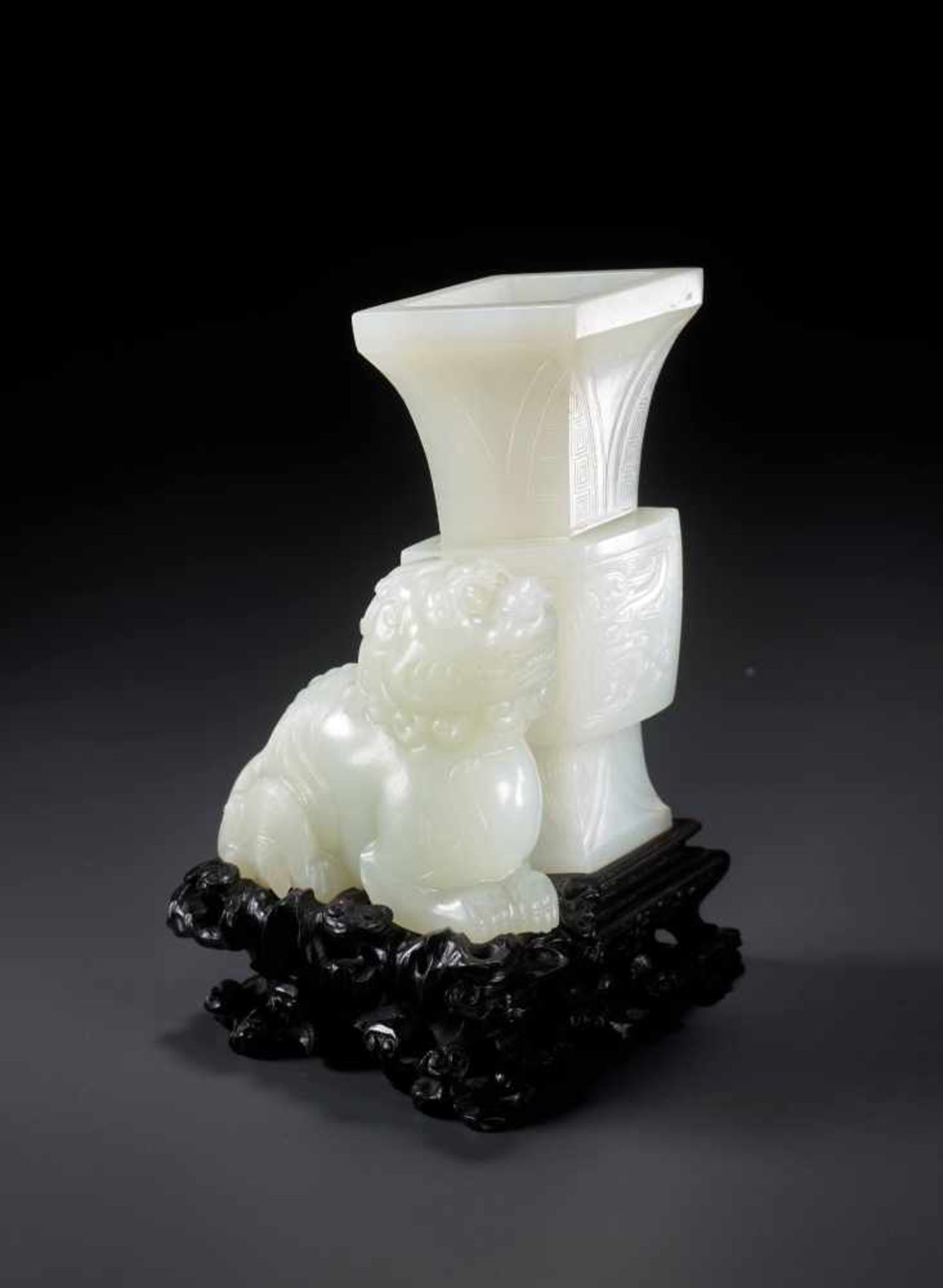 AN IMPORTANT MUTTON FAT WHITE JADE ‘LION’ FANGGU VASE, QIANLONG PERIOD White mutton fat jade,