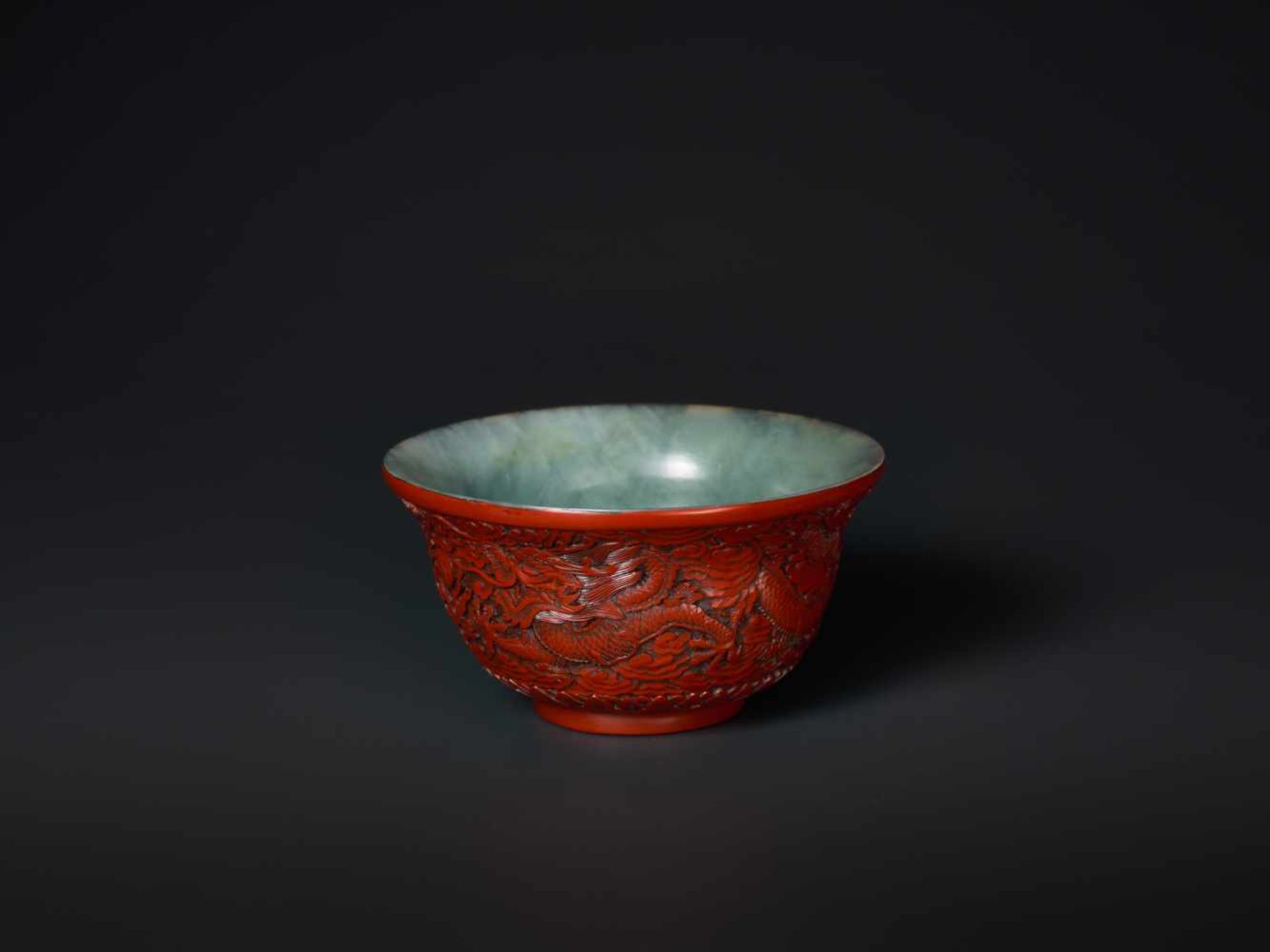 AN EXTREMELY RARE QIANLONG PERIOD CINNABAR LACQUER EMBELLISHED JADE BOWL Celadon and grey streaked - Image 4 of 7