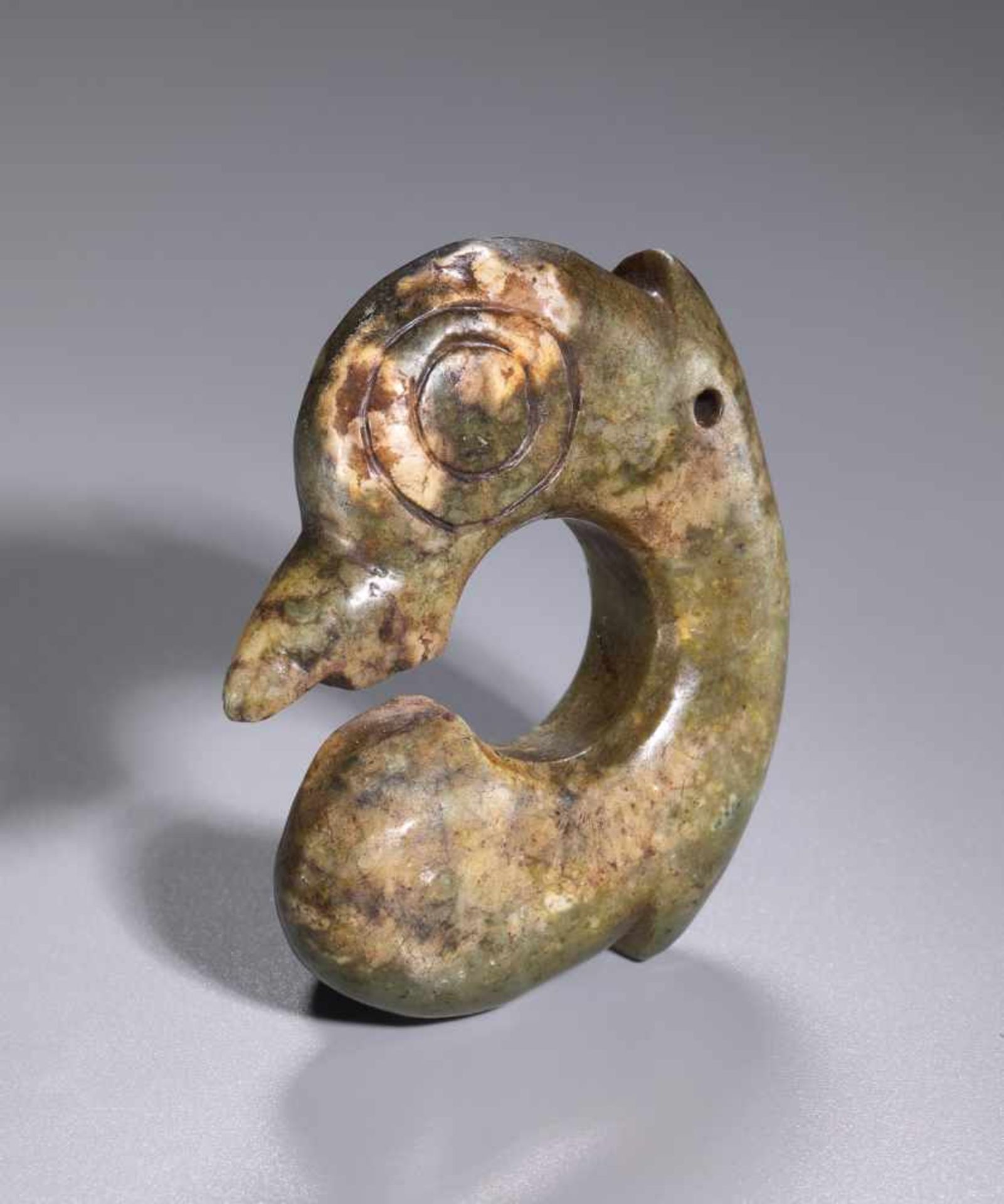 A VERY RARE HONGSHAN CARVING OF A BIRD-LIKE CREATURE Jade. China, Late Neolithic period, Hongshan