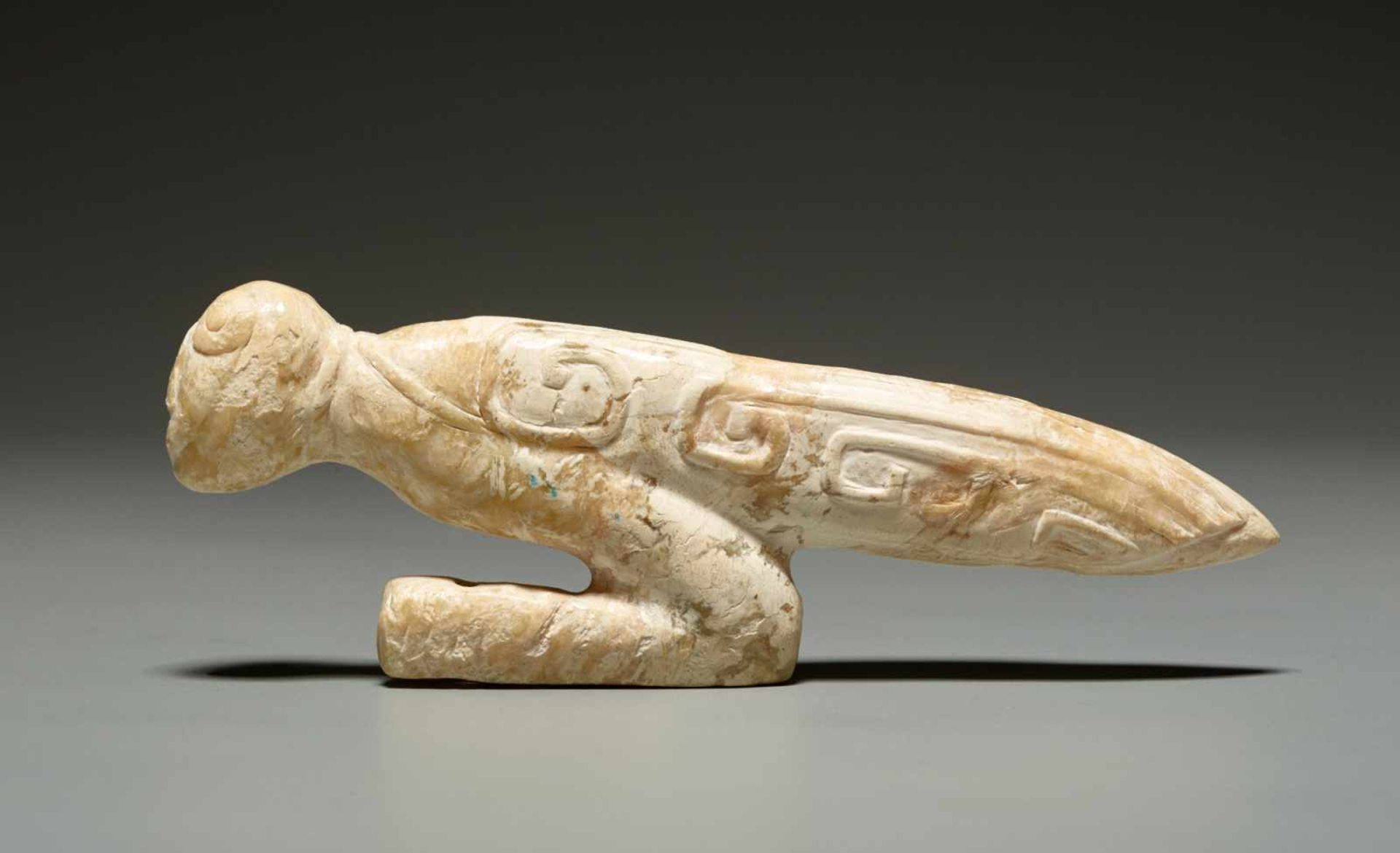 A LATE SHANG SCULPTURAL PRAYING MANTIS IN ALTERED JADE WITH AN IVORY QUALITY Jade. China, Late Shang