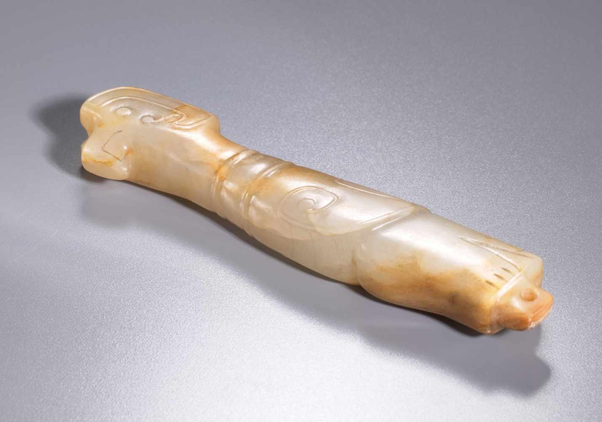 AN EXQUISITE FINIAL IN WHITE JADE CARVED AS AN ELONGATED BIRD IN PROFILE Jade. China, Late Shang - Image 7 of 11