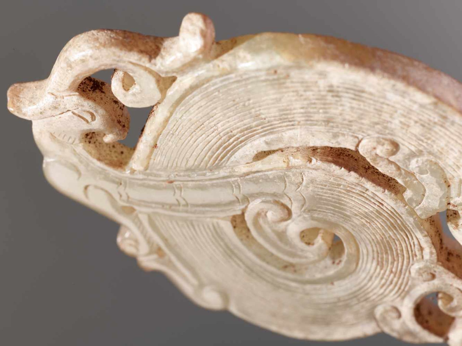 A WELL-DETAILED CARVING OF A DRAGON AND A PHOENIX IN PALE GREEN JADE Jade. China, Late Eastern Zhou, - Image 5 of 10