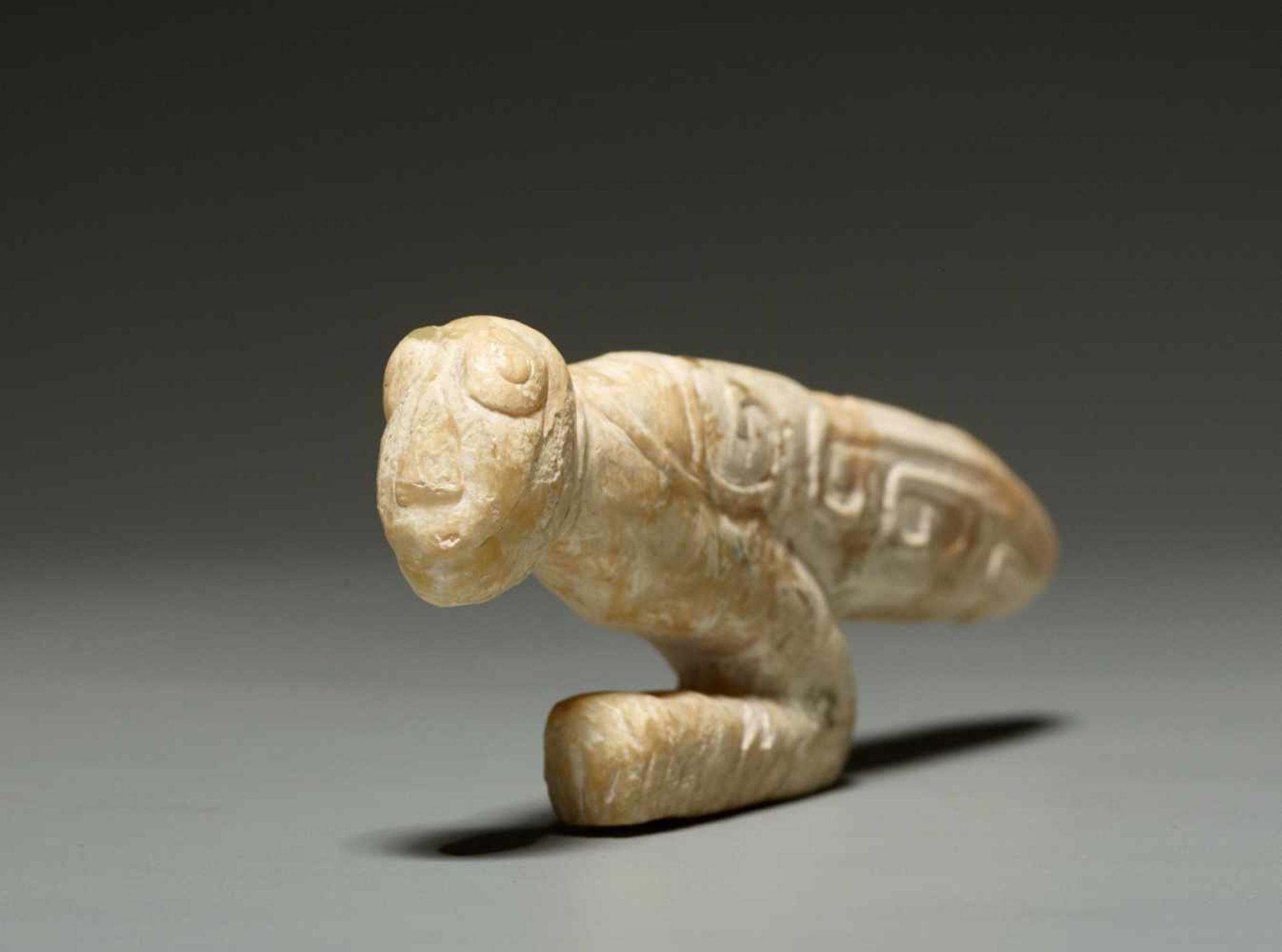 A LATE SHANG SCULPTURAL PRAYING MANTIS IN ALTERED JADE WITH AN IVORY QUALITY Jade. China, Late Shang - Image 5 of 11