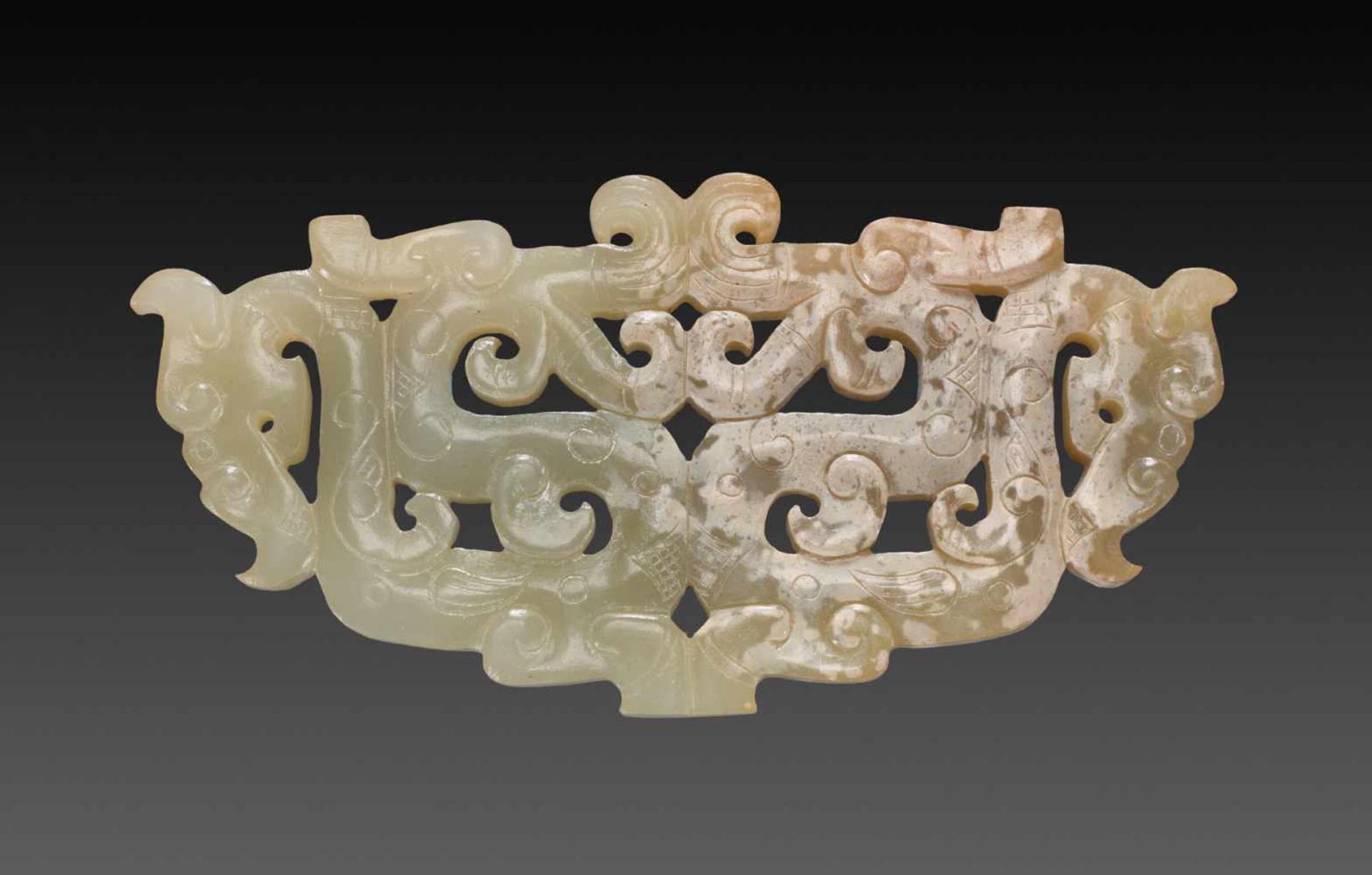 A BEAUTIFUL EASTERN ZHOU ORNAMENT WITH AN OPENWORK PATTERN OF DRAGONS Jade. China, Eastern Zhou, 5th