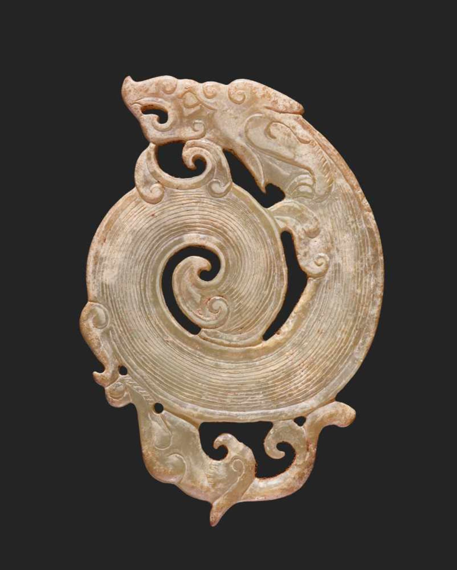 A WELL-DETAILED CARVING OF A DRAGON AND A PHOENIX IN PALE GREEN JADE Jade. China, Late Eastern Zhou,