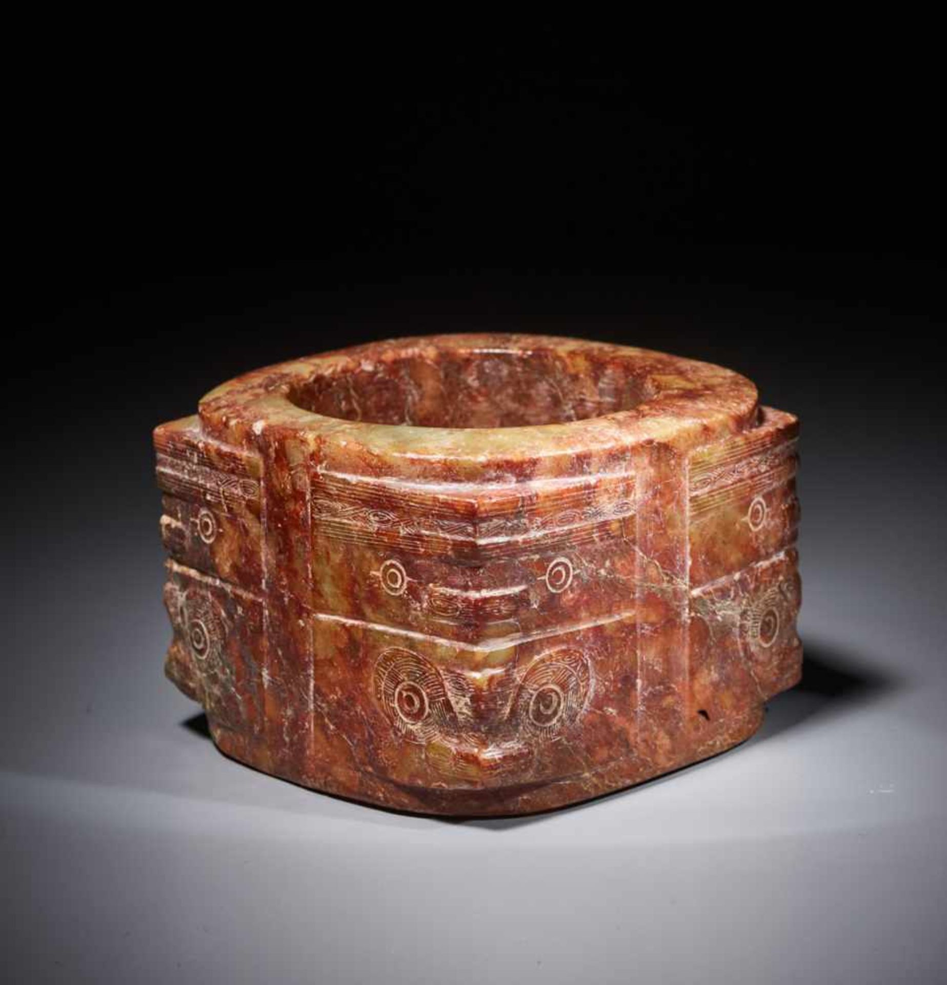 A WELL-CARVED TWO-TIERED LIANGZHU CONG WITH STYLIZED MASKS Jade. China, Late Neolithic period,