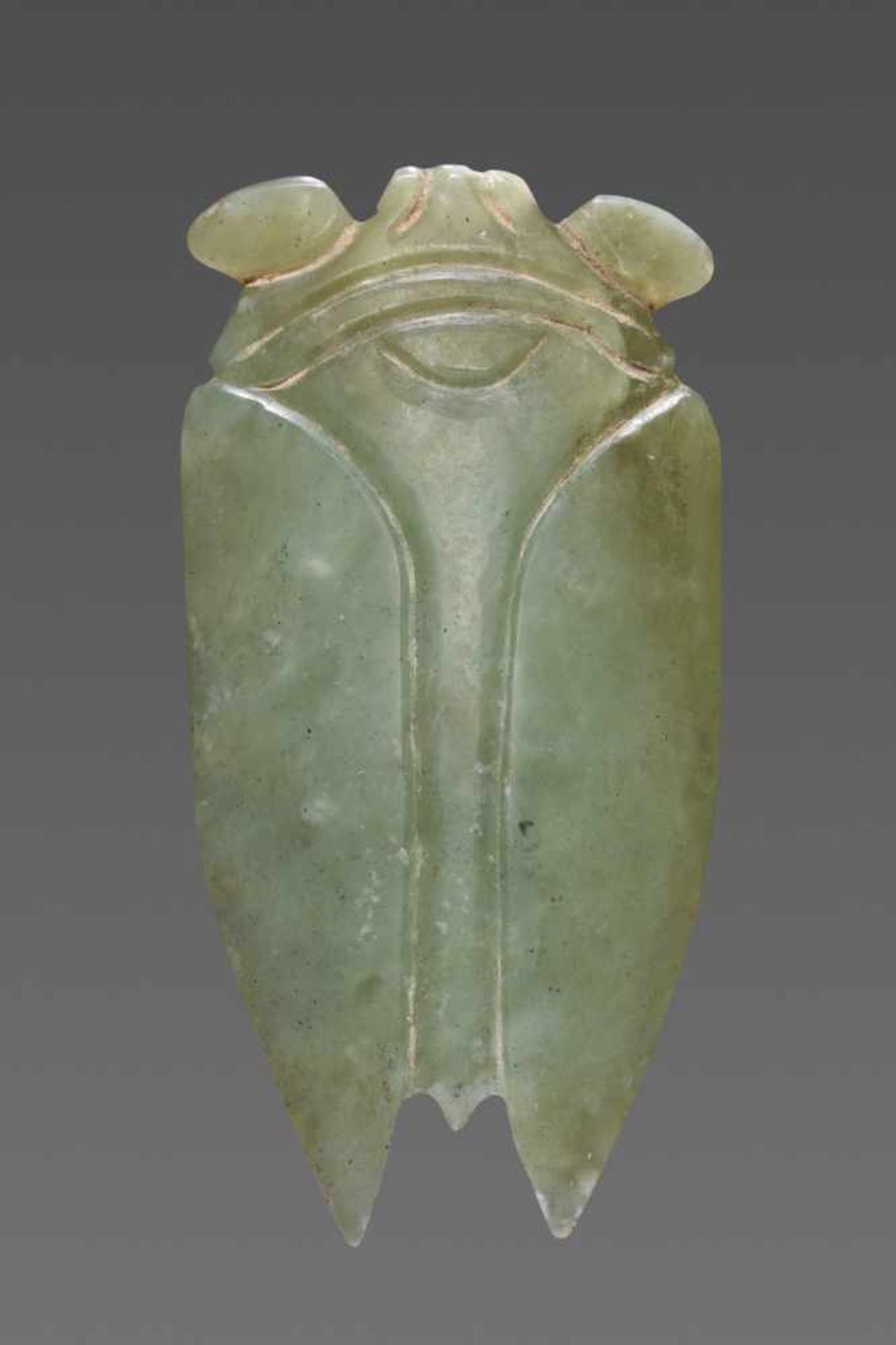 A SUPERB HAN CICADA IN LIGHT GREEN JADE Jade. China, Han Dynasty, 2nd - 1st century BC 玉蟬 -漢代,