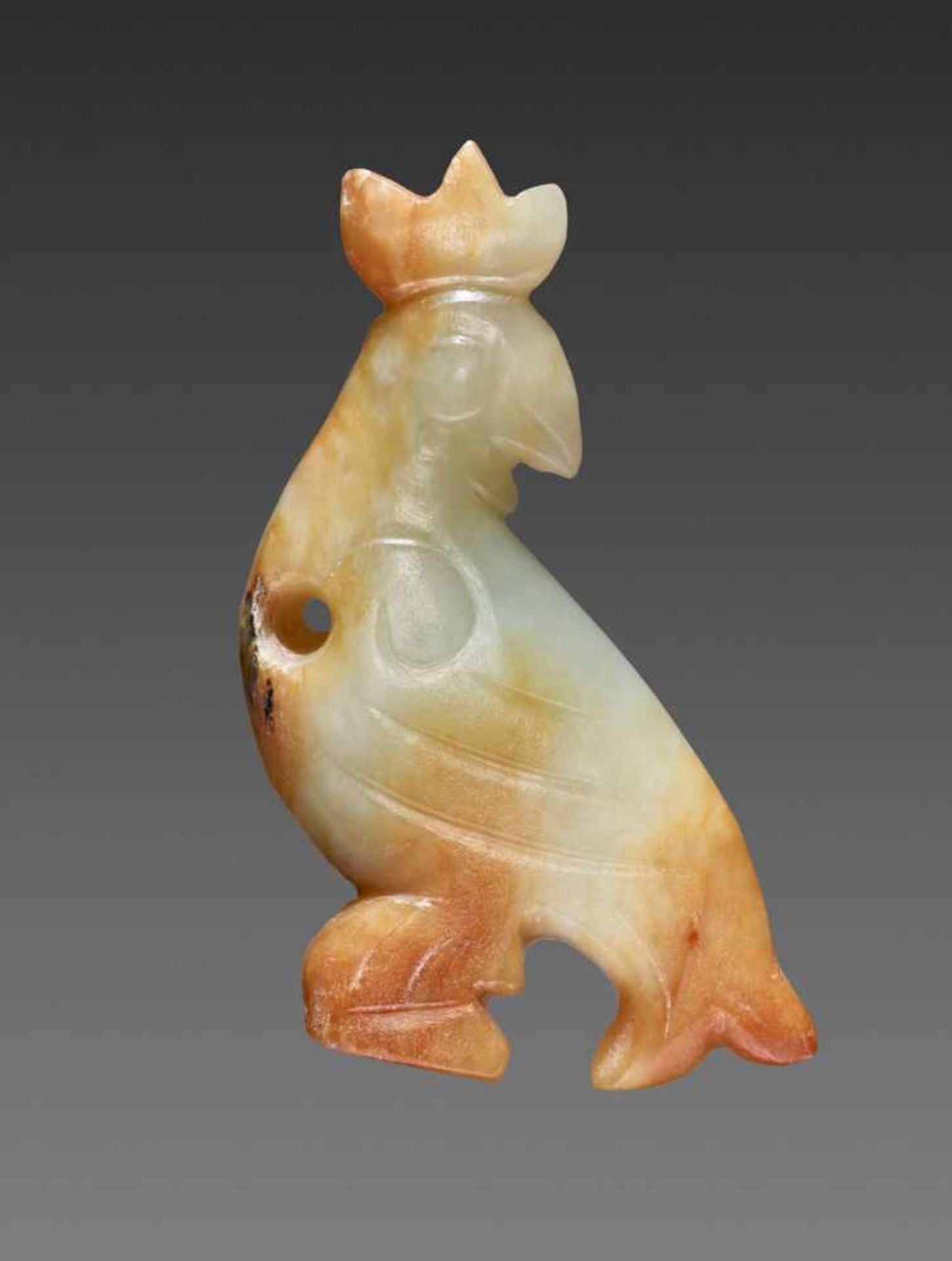 A CHARMING, TINY CARVING OF A BIRD WITH A JAGGED CREST Jade. China, Western Zhou, 11th - 10th