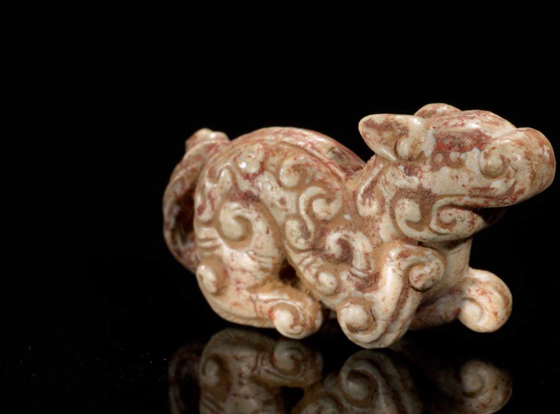 A MINISCULE CROUCHING ANIMAL WITH AN INTRICATE PATTERN OF CARVED CURLS Jade. China, Eastern Zhou, - Image 5 of 12