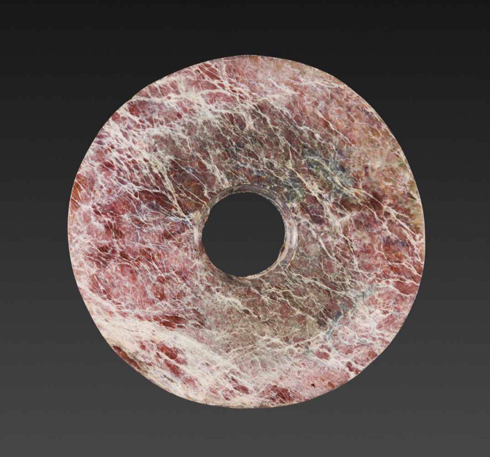 AN AMAZING NEOLITHIC BI DISC IN REDDISH JADE WITH INTRICATE NATURAL VEINING Jade. China, Late