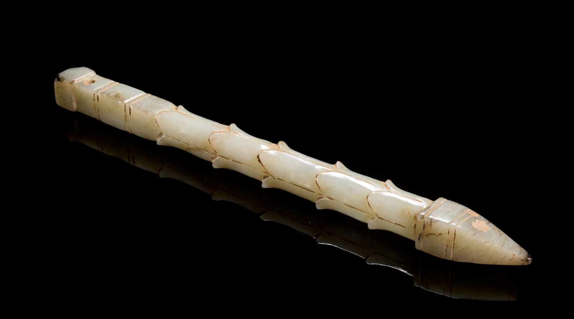 A SOPHISTICATED HANDLE-SHAPED OBJECT IN WHITE JADE DECORATED WITH LEAF PATTERNS Jade. China, Late