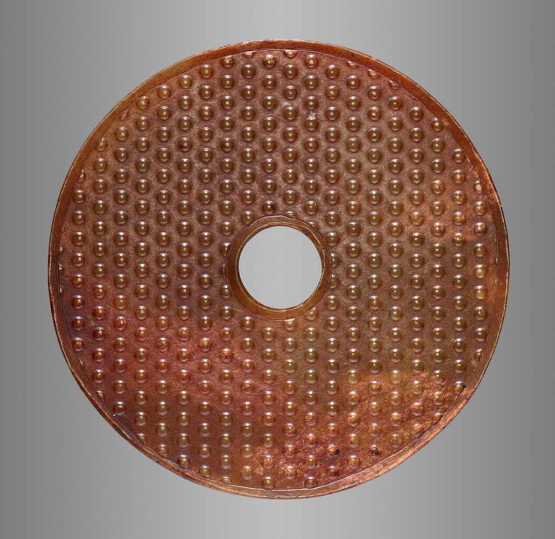 AN ATTRACTIVE AMBER COLOURED BI DISC WITH A PATTERN OF RAISED BOSSES Jade. China, Han Dynasty, 2nd - - Image 2 of 8