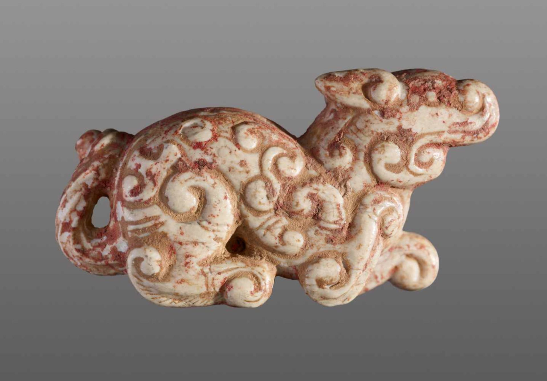 A MINISCULE CROUCHING ANIMAL WITH AN INTRICATE PATTERN OF CARVED CURLS Jade. China, Eastern Zhou, - Image 6 of 12