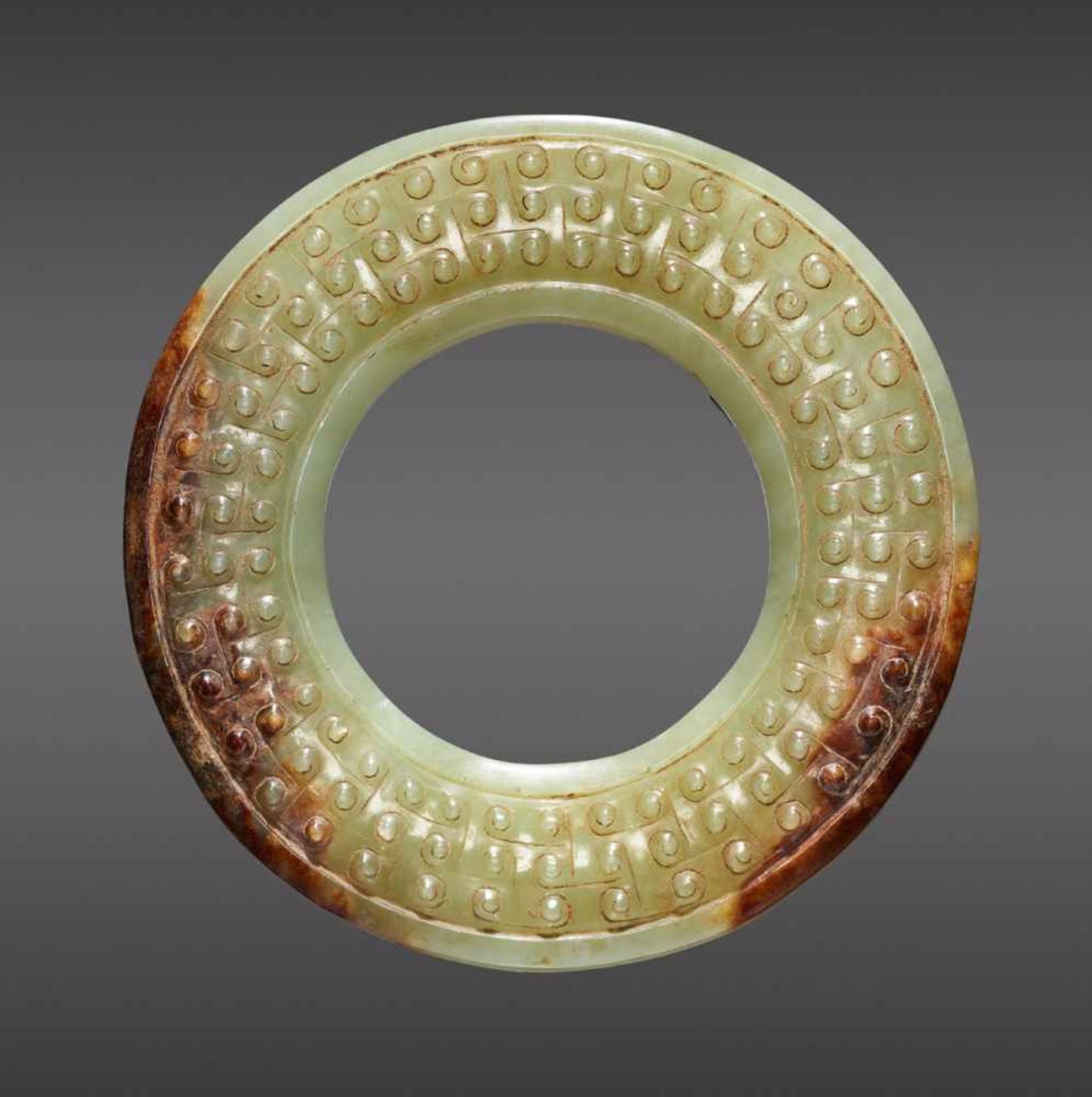 A STUNNING CELADON GREEN DISC EXQUISITELY CARVED WITH TWO CHI DRAGONS IN RELIEF ON TOP AND JOINED - Image 3 of 10