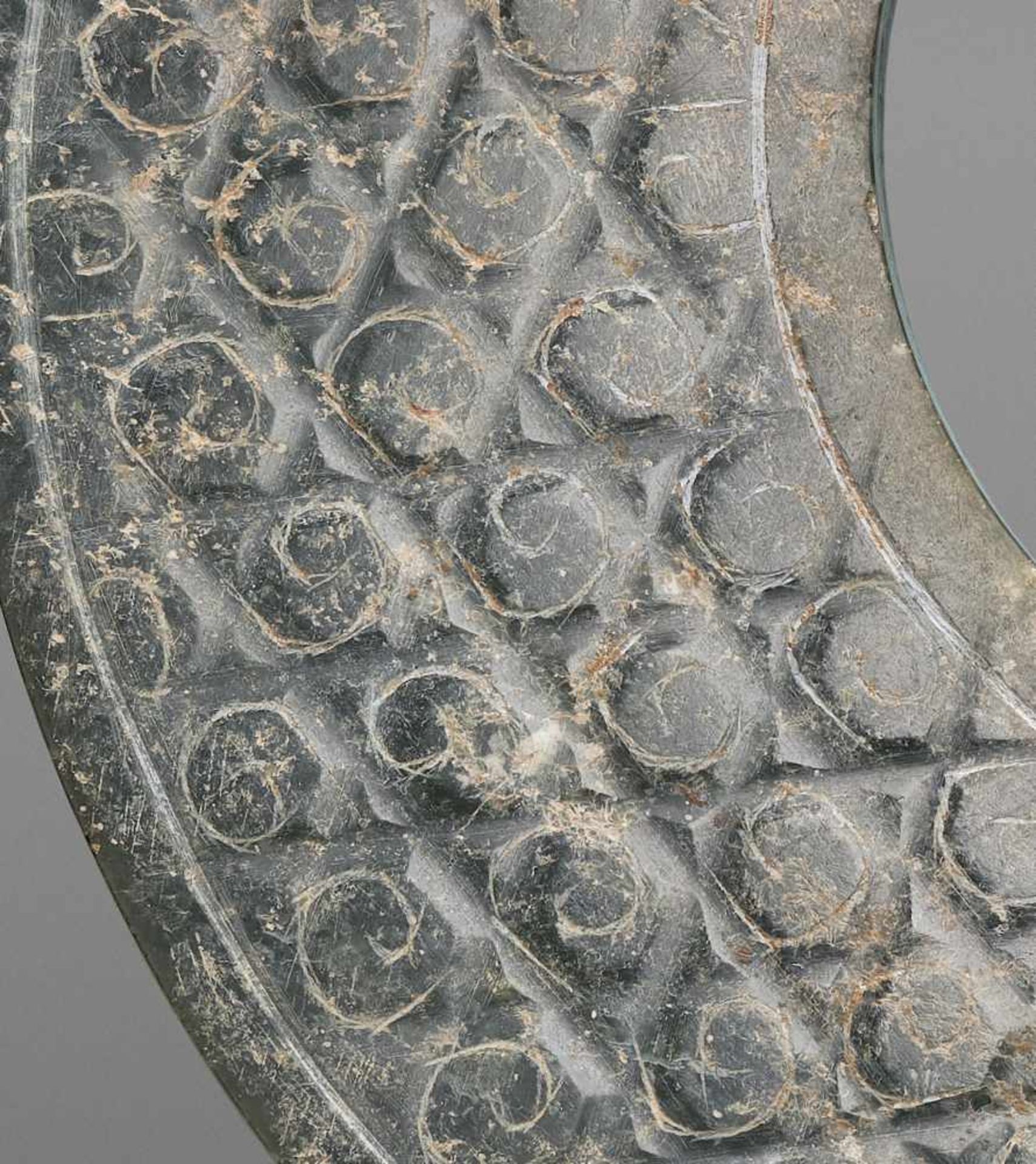 A SHINY GREEN DISC WITH A DELICATE PATTERN OF INCISED SCROLLS Jade. China, Han Dynasty, 2nd - Image 8 of 10