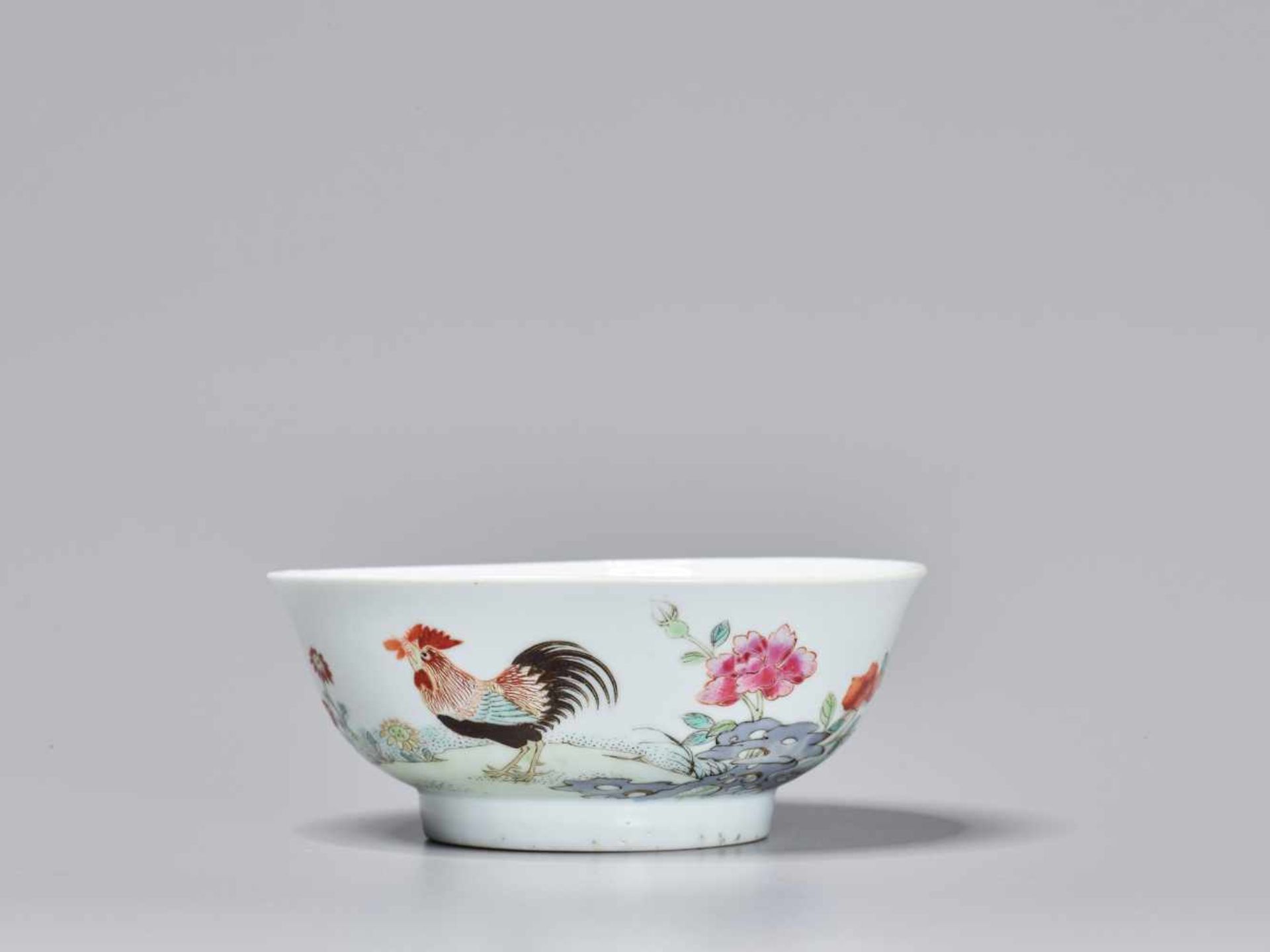 A FAMILLE ROSE ‘COCKEREL EATING FLY’ PORCELAIN BOWL, 18TH CENTURY Four-character Yongzheng mark