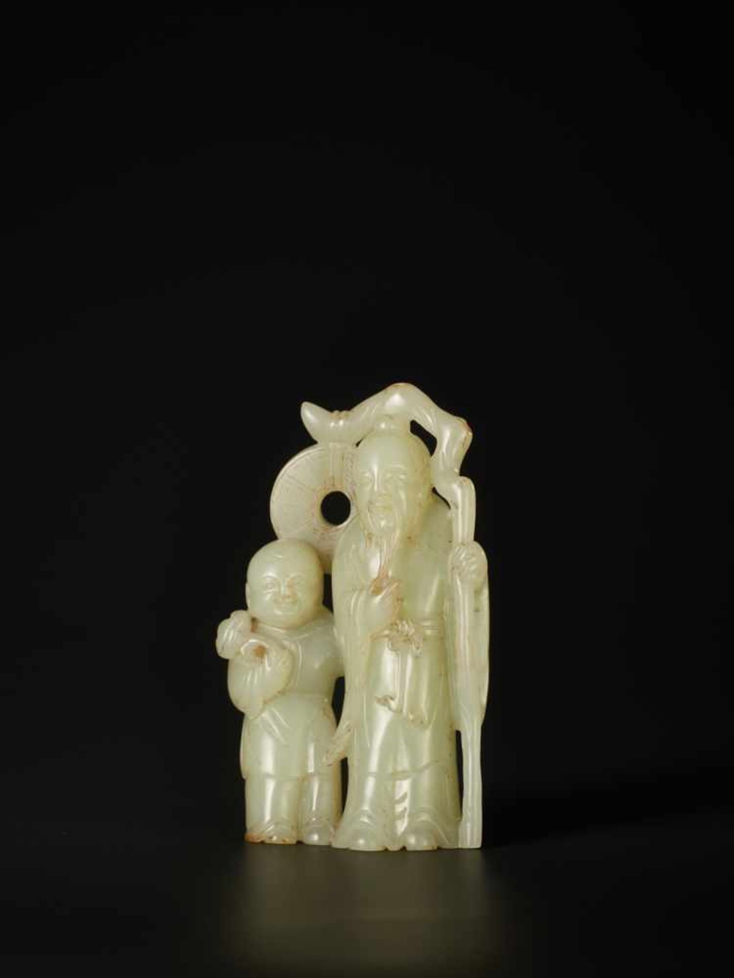 A PALE CELADON CARVING OF ‘LIU HAI AND ZHONGLI QUAN’, QING DYNASTY The jade of pale celadon tone, - Image 2 of 6