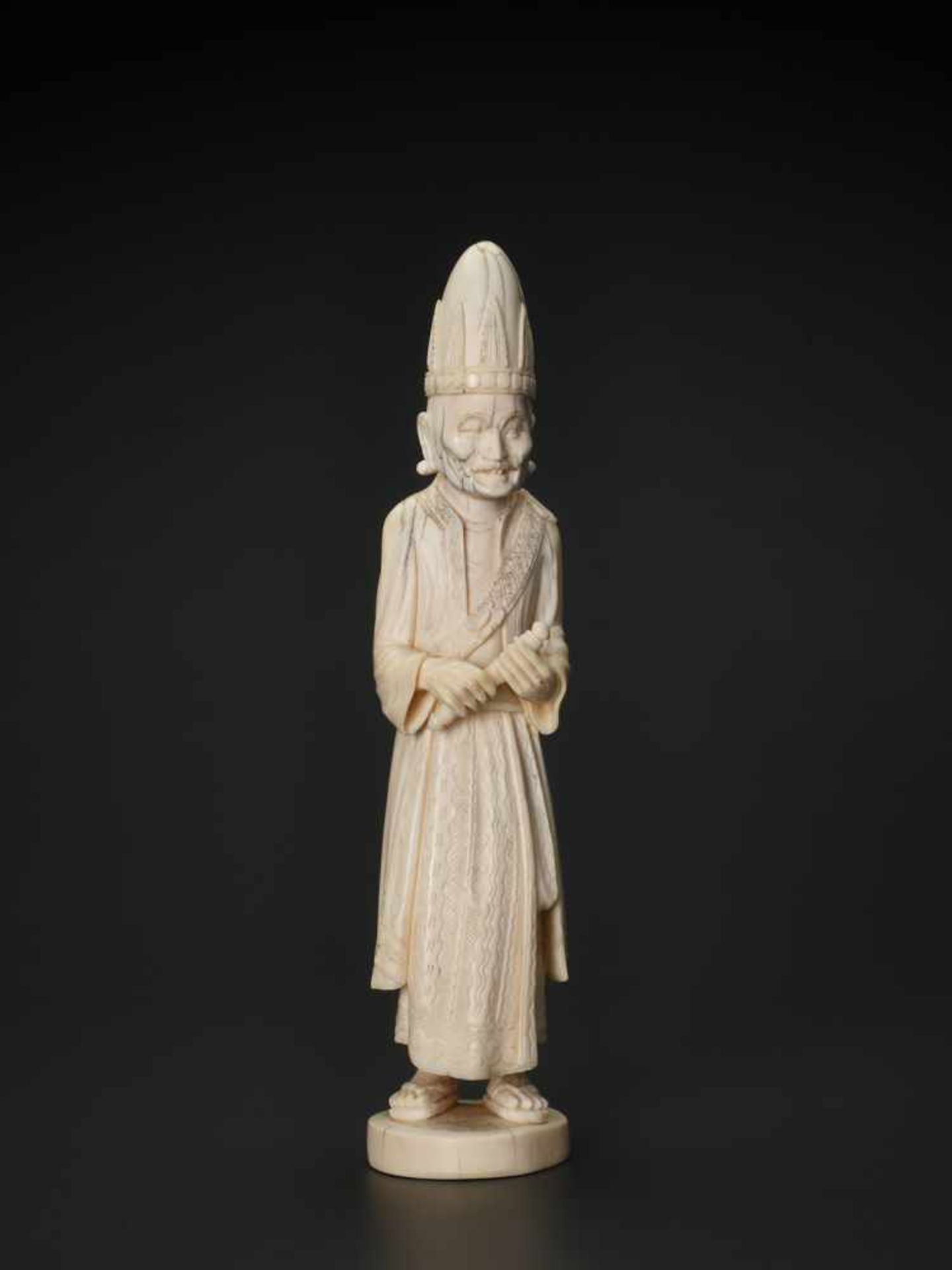 A 19TH CENTURY INDO-PERSIAN IVORY SCULPTURE OF A PRIEST Ivory India, 19th century This finely carved