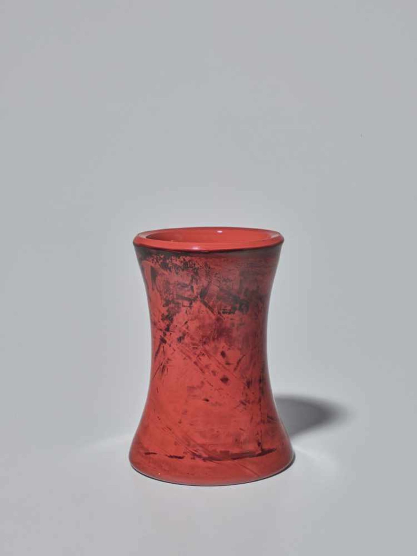 A ‘REALGAR’ IMITATION GLASS BRUSH POT, QING DYNASTY The tapered body rising from a flat base, the