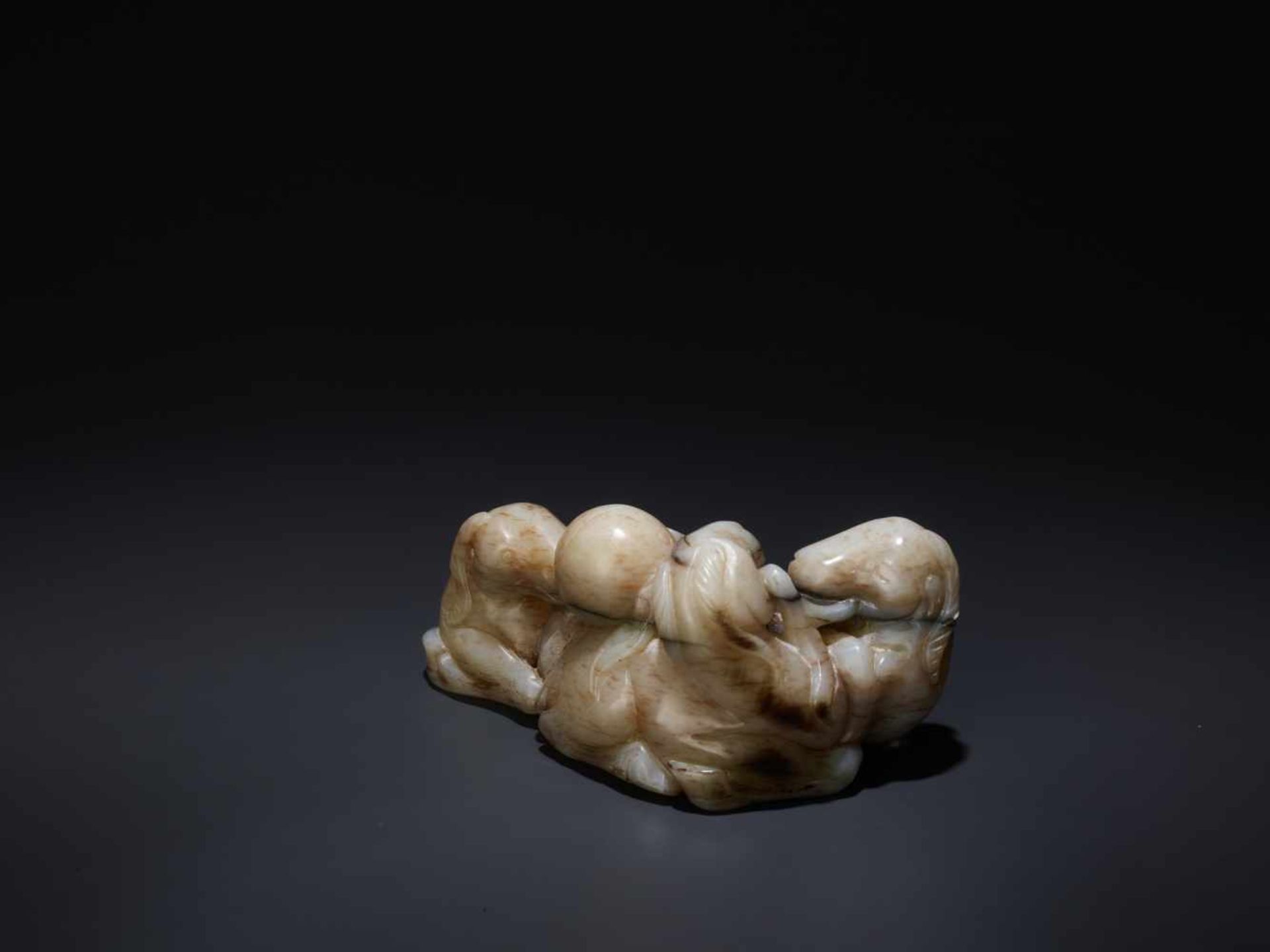 A CHICKEN BONE ‘SAN YANG’ THREE RAMS JADE GROUP, 17TH CENTURY The greyish-white nephrite suffused - Image 3 of 8