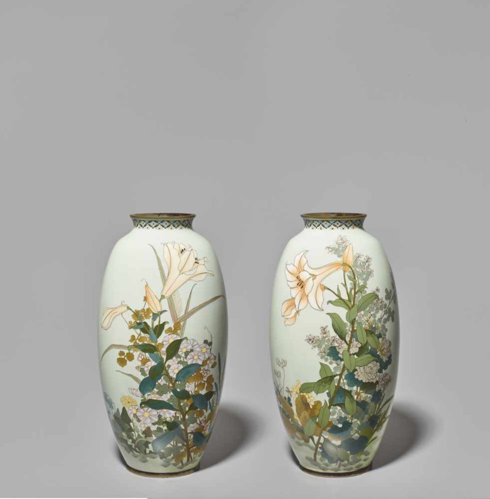 A LARGE PAIR OF JAPANESE ENAMEL CLOISONNÉ VASES WITH YURI LILIES AND MANY SEASONAL FLOWERS Cloisonné