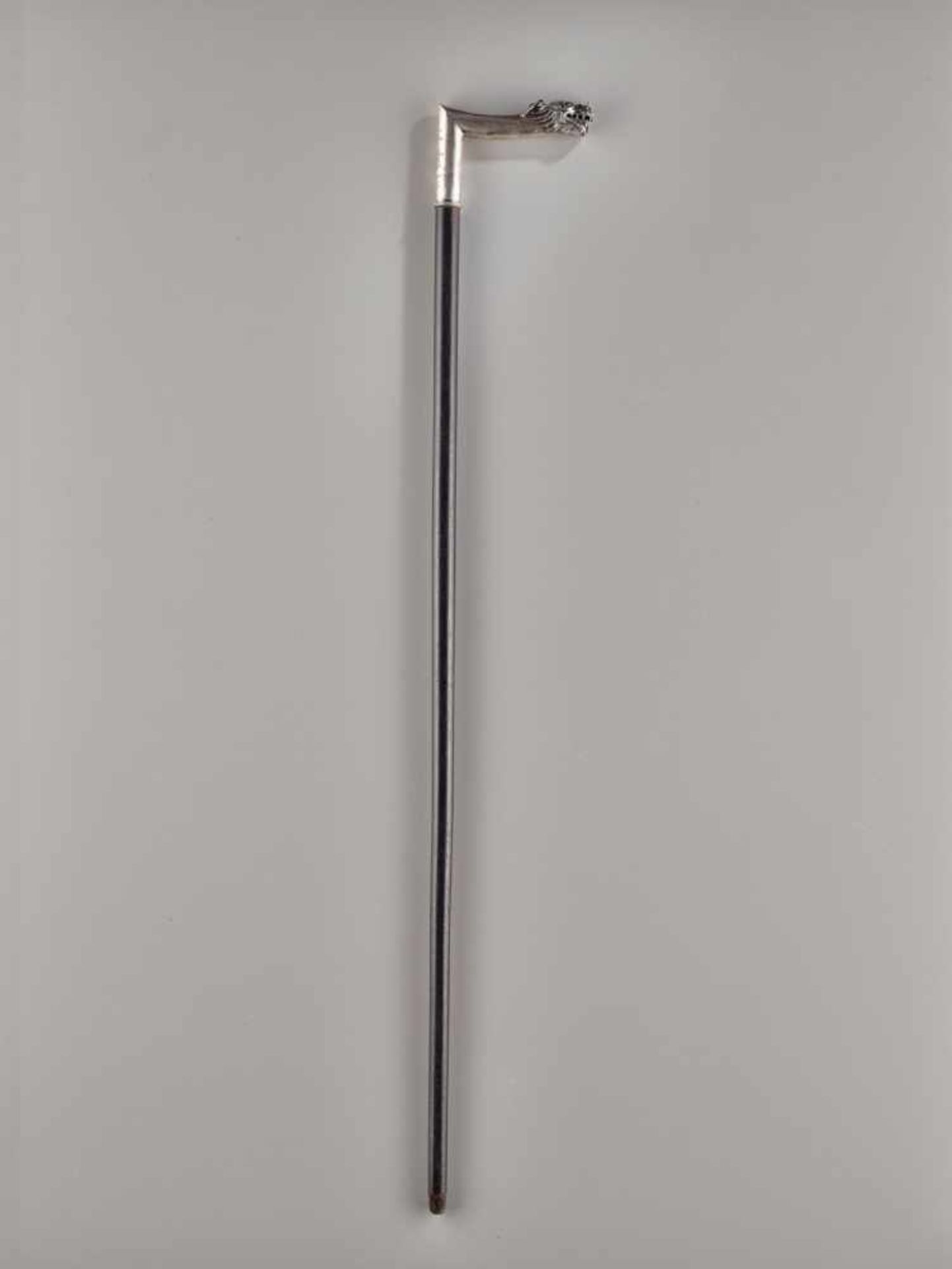 A SILVER ‘DRAGON’ WALKING CANE, QING DYNASTY The shaft is made of black hardwood (possibly zitan),