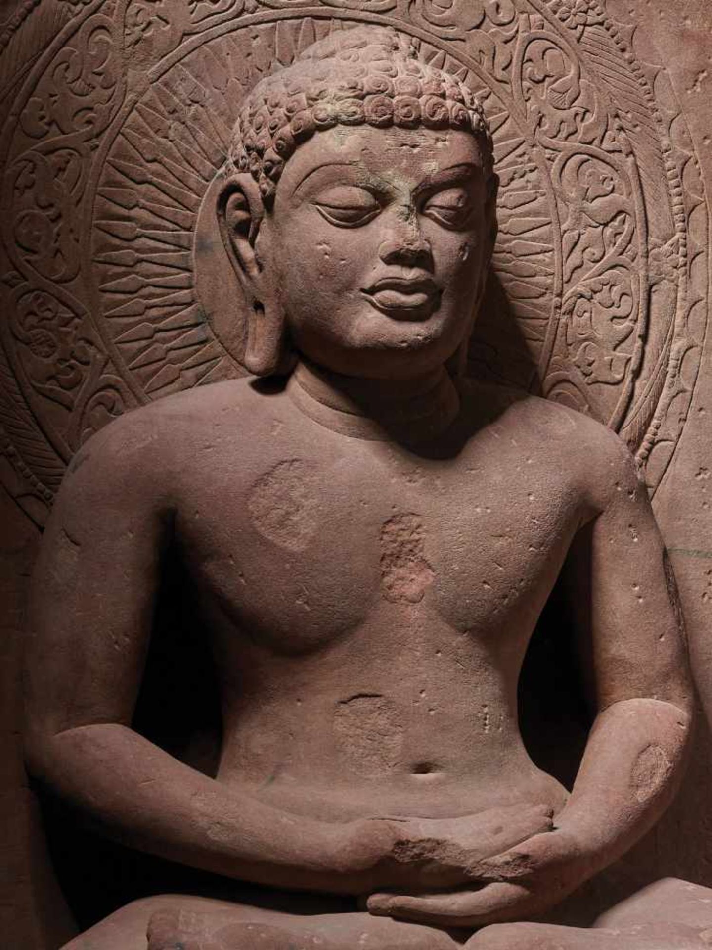 A LARGE AND IMPORTANT SANDSTONE STELE OF MAHAVIRA, MADHYA PRADESH, 16TH- 18TH CENTURY Red sandstone,