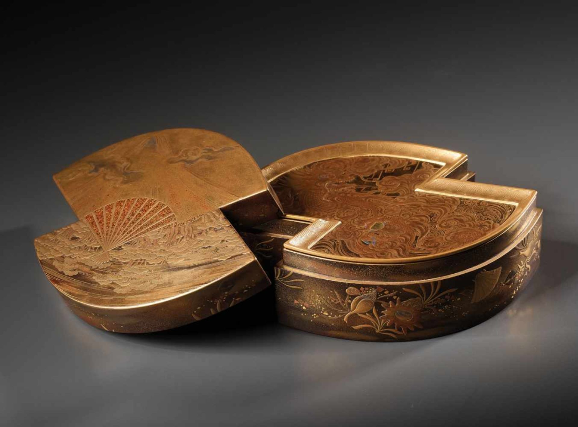 AN IMPORTANT AND MASTERFULLY EXECUTED JAPANESE LACQUER TEBAKO WITH MOUNT FUJI, DRAGON AND