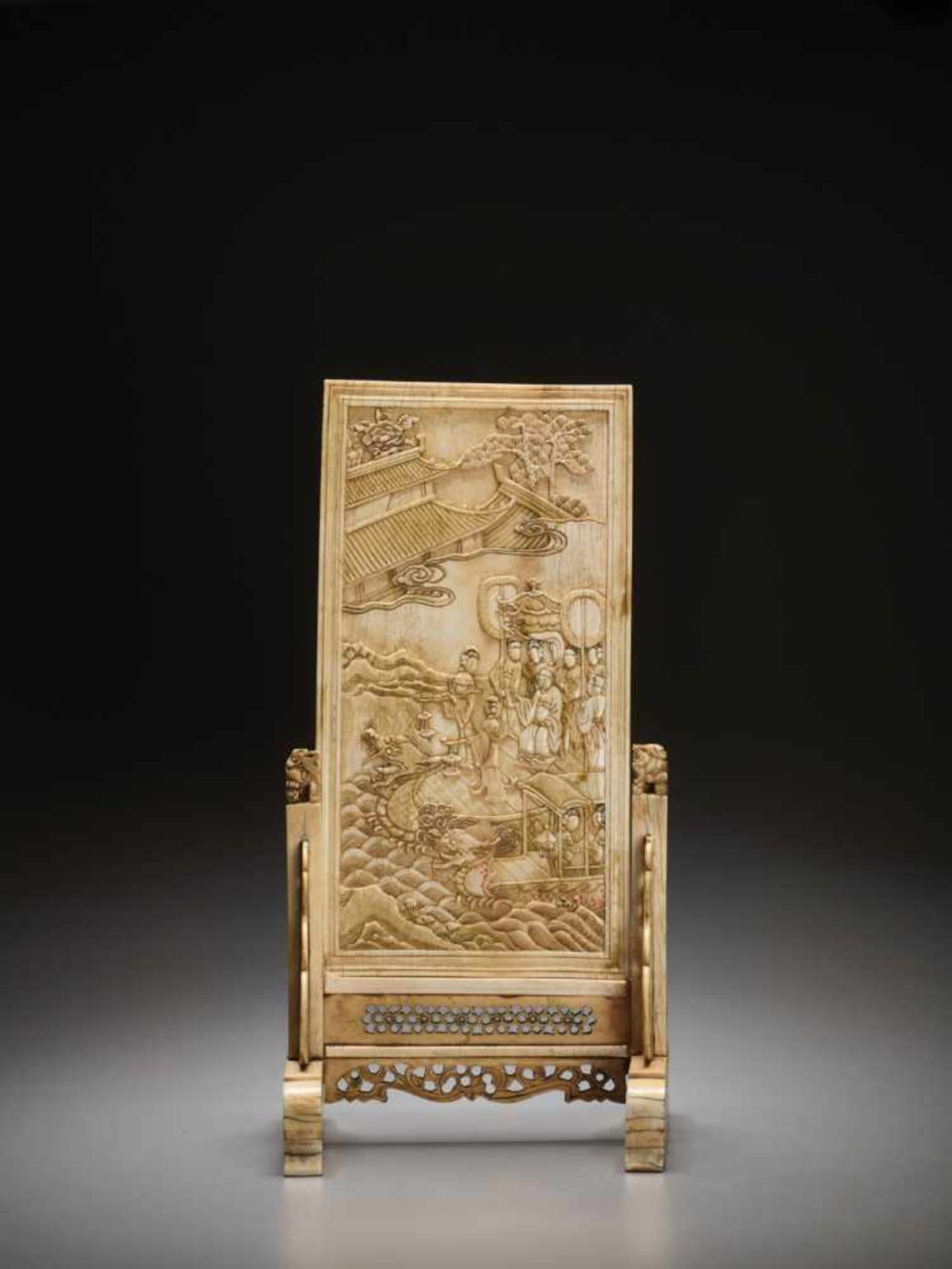 AN IVORY DOUBLE-SIDED ‘IMMORTALS AND DRAGON BOAT’ TABLE SCREEN, KANGXI Ivory engraved and carved