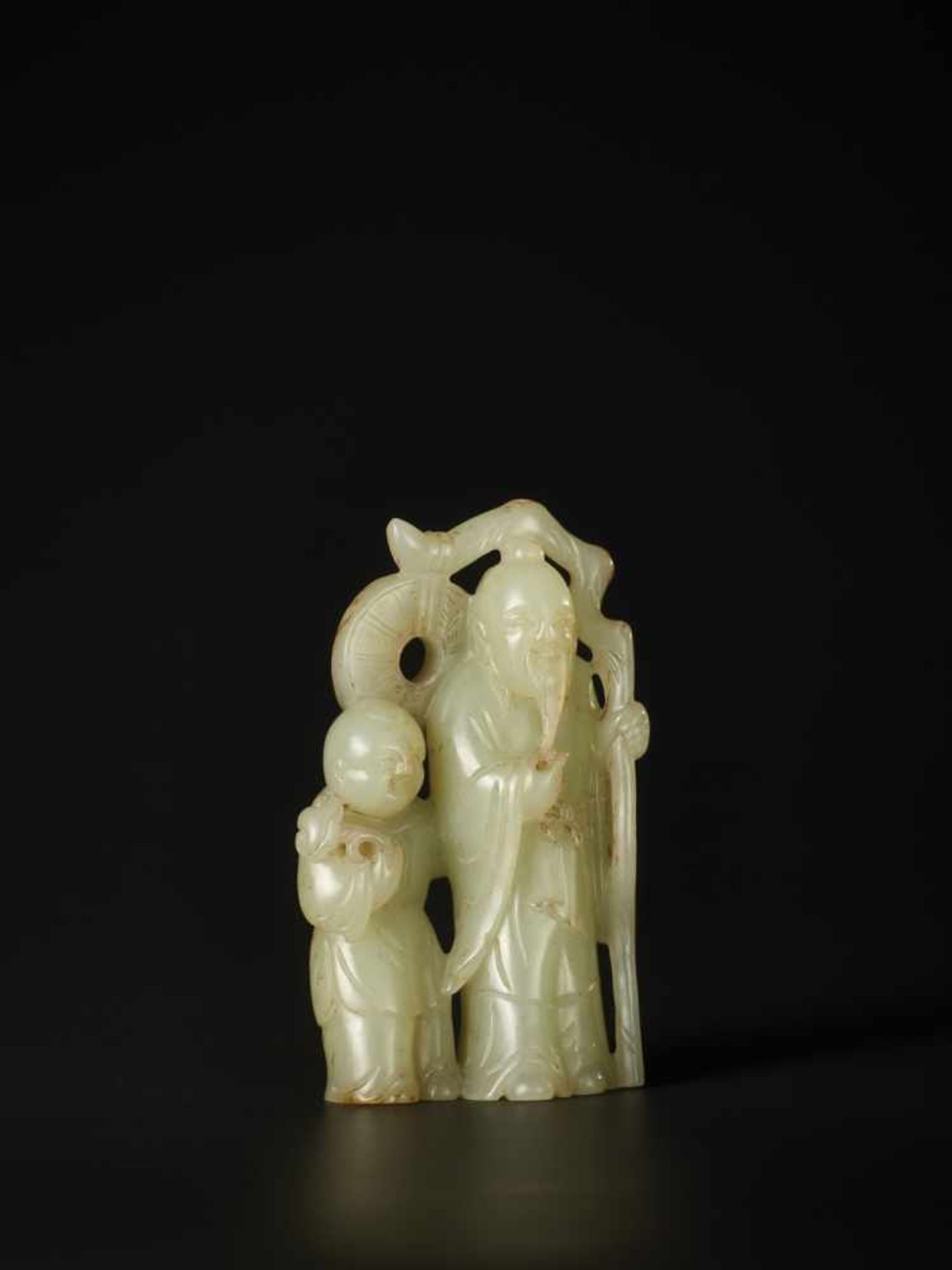 A PALE CELADON CARVING OF ‘LIU HAI AND ZHONGLI QUAN’, QING DYNASTY The jade of pale celadon tone,