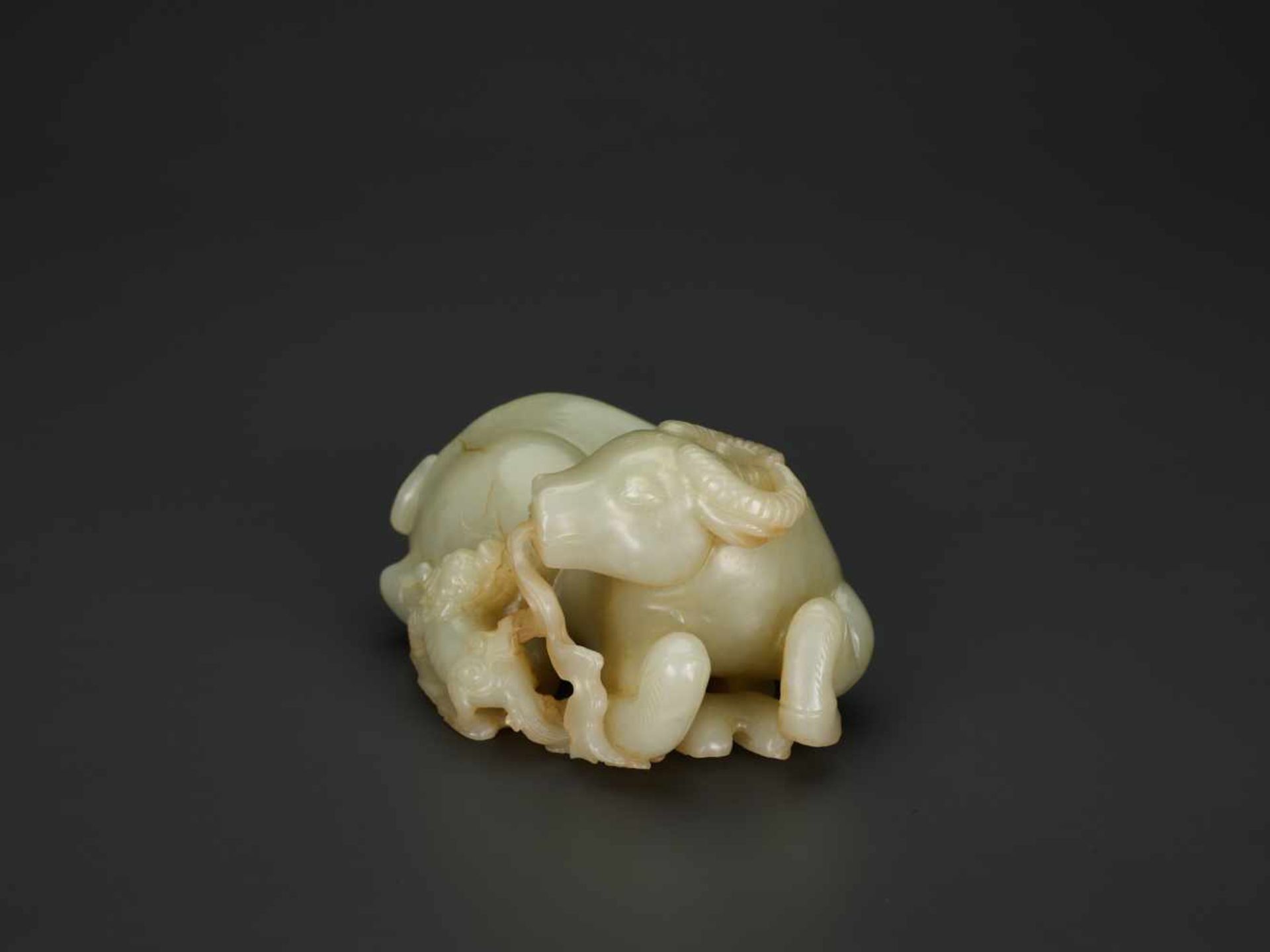 A PALE CELADON JADE 'BUFFALO AND QILIN' GROUP, QIANLONG PERIOD (1736-1795) The pale celadon nephrite - Image 3 of 7