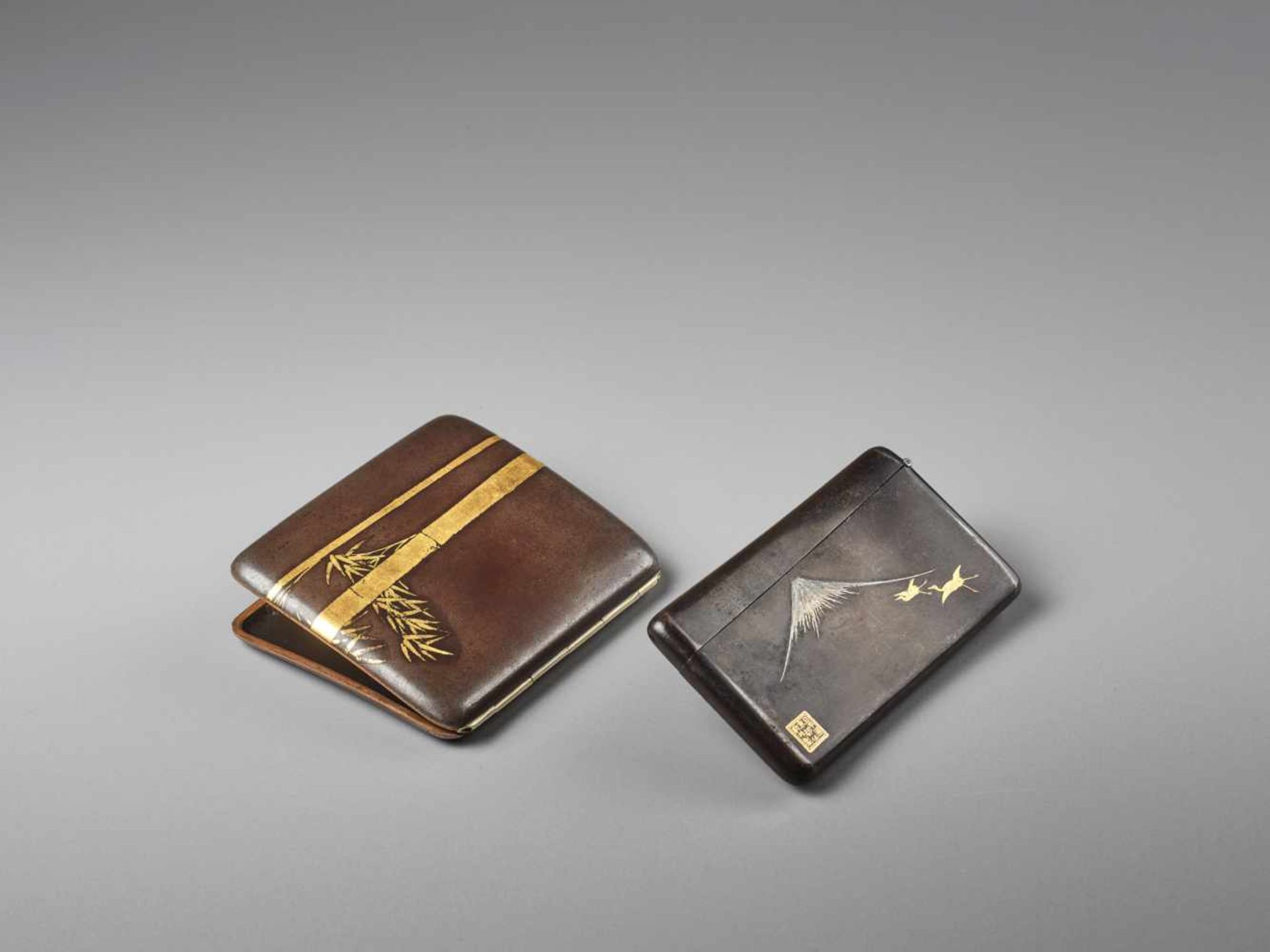TWO INLAID JAPANESE IRON CIGARETTE CASES BY THE KOMAI COMPANY Iron with goldJapan, Meiji period (
