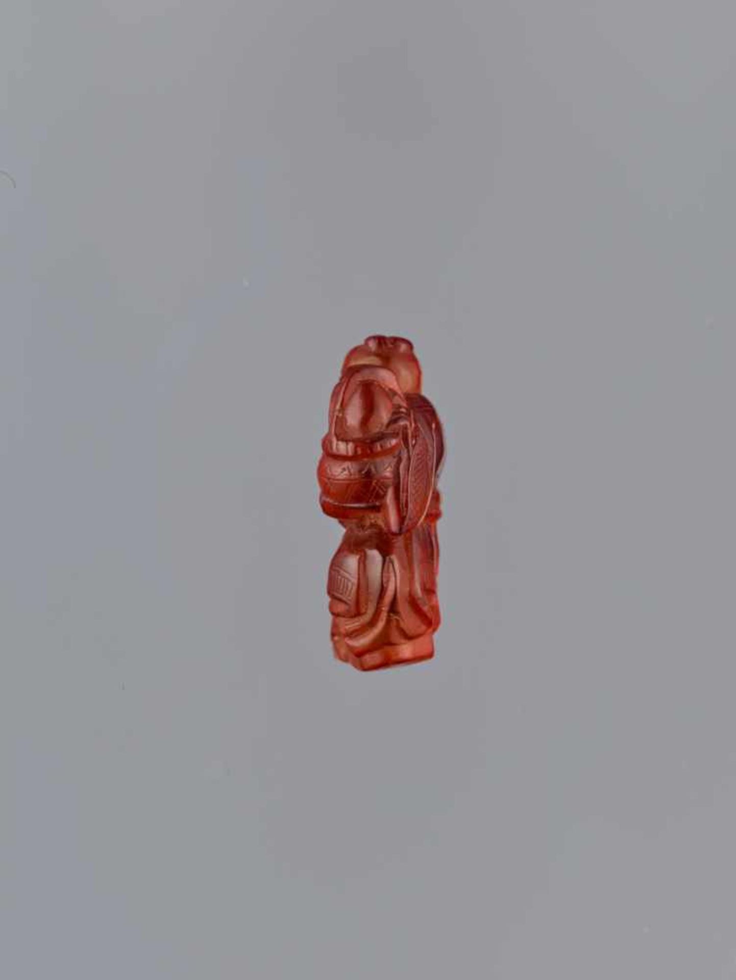 A QING DYNASTY AMBER CARVING OF BOY WITH BASKET Amber of bright orange color and of near translucent - Image 4 of 7