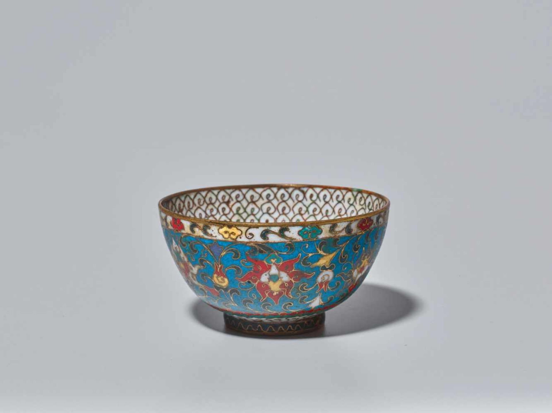 A CLOISONNE ENAMEL ‘LOTUS’ BOWL, MING DYNASTY, 16TH CENTURY The bronze bowl with gilt rims and